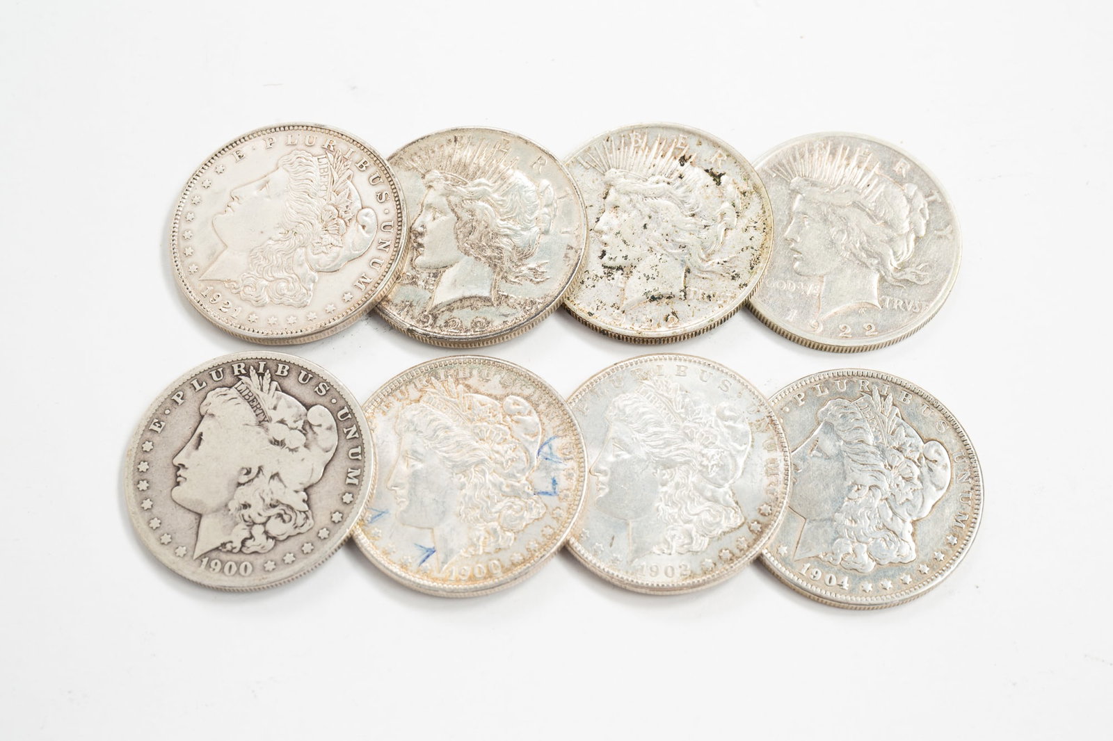 EIGHT SILVER MORGAN AND PEACE DOLLARS. (1 of 4)