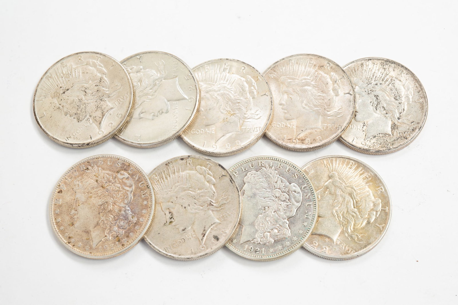 NINE SILVER MORGAN AND PEACE DOLLARS. (1 of 4)