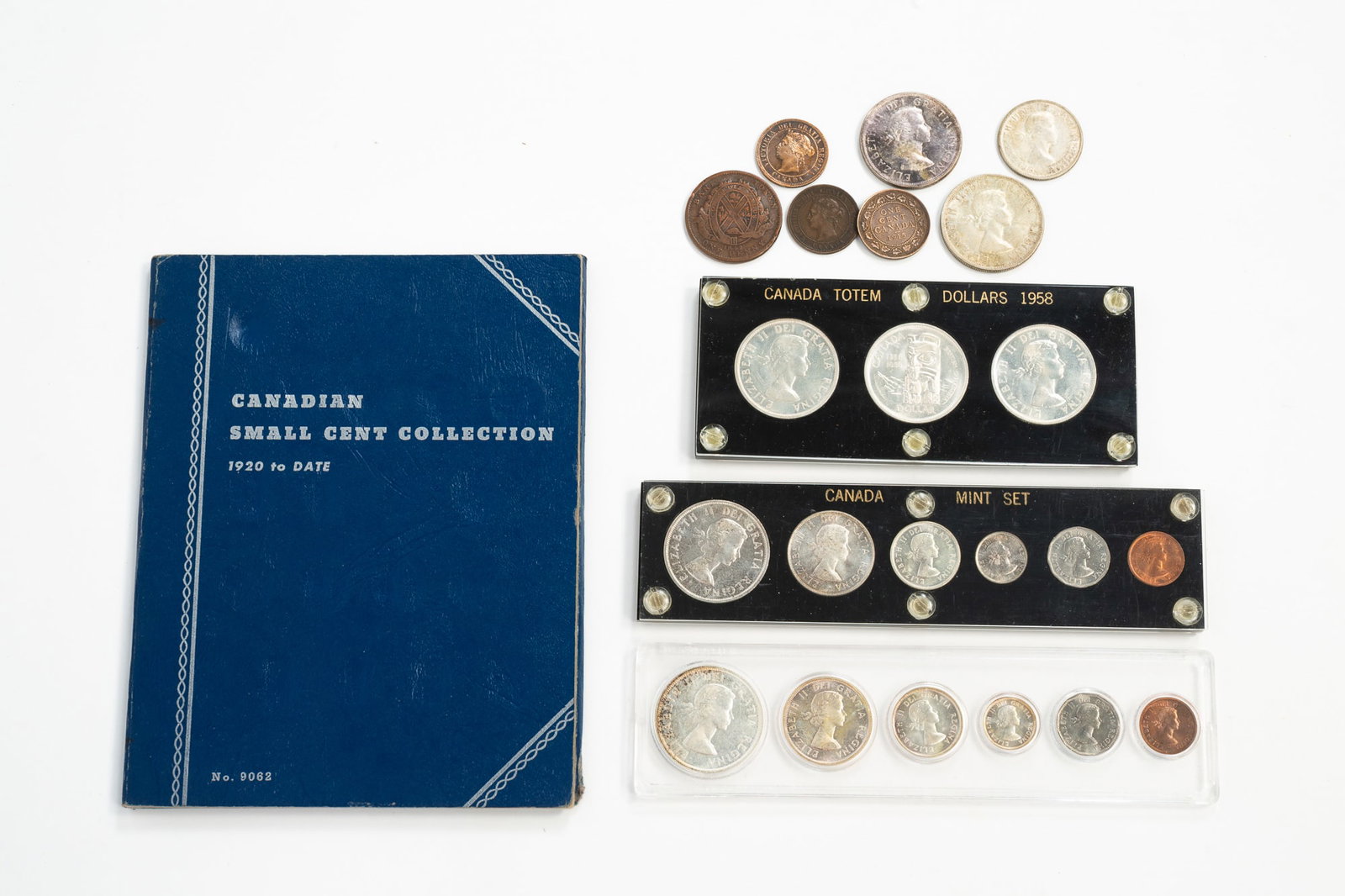 GROUP OF CANADIAN COINS INCLUDING TOTEM DOLLARS, MINT SETS AND WHITMAN COIN ABLUM OF SMALL CENTS. (1 of 5)