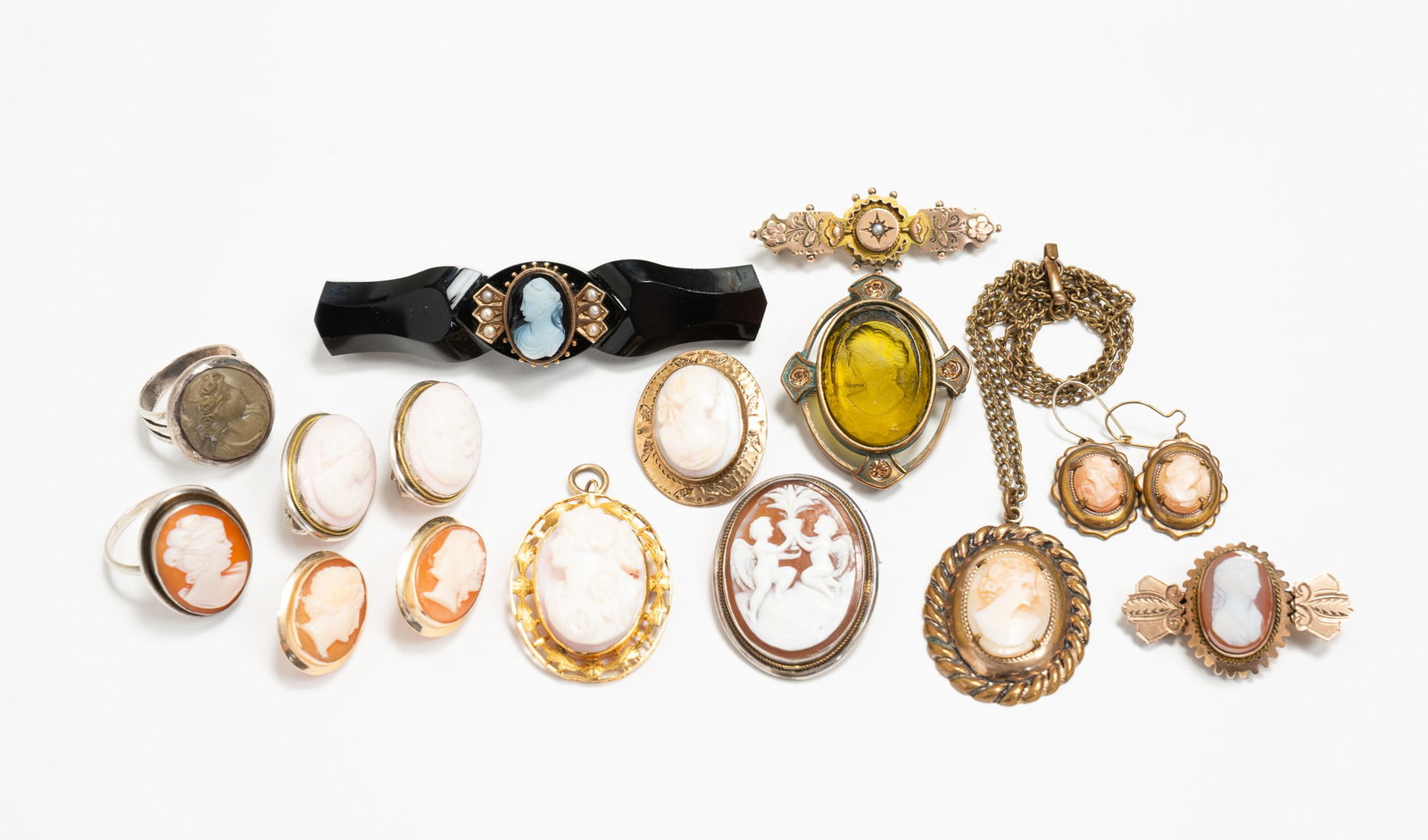 GROUP OF CARVED CAMEOS INCLUDING STERLING AND 800 SILVER. (1 of 6)