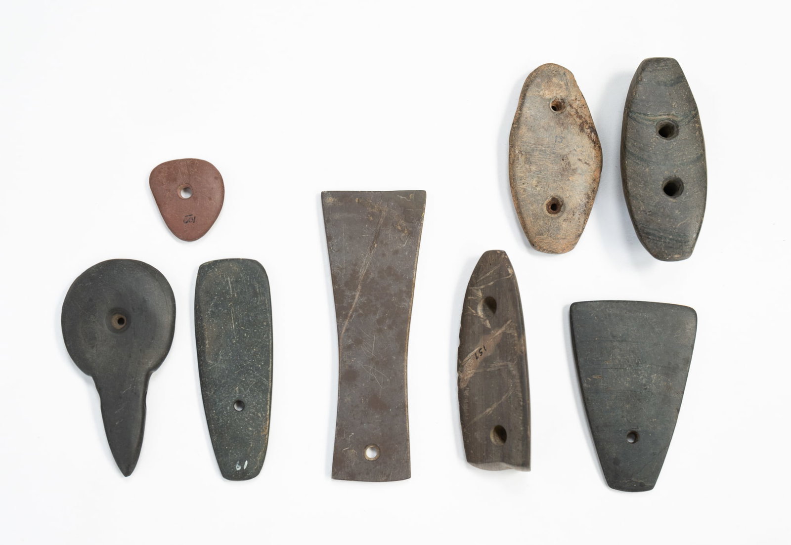 EIGHT NATIVE AMERICAN STONE GORGETS. - 2