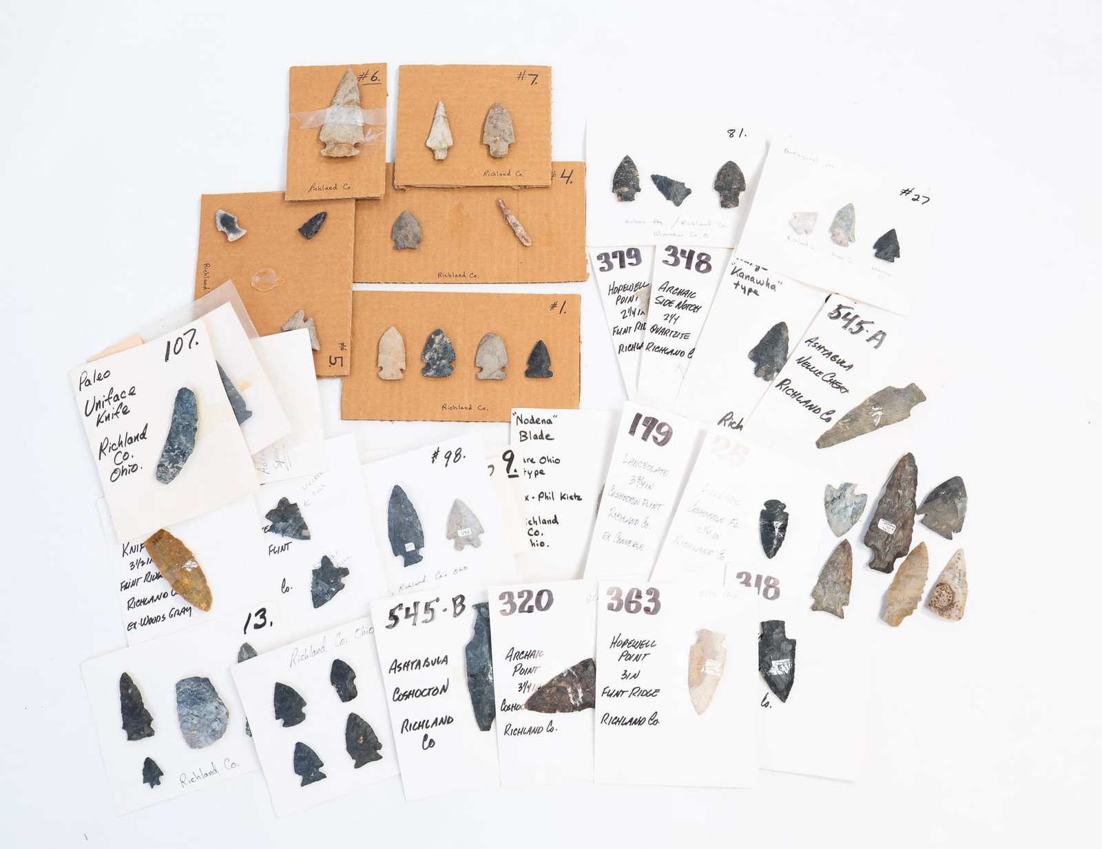 COLLECTION OF RICHLAND COUNTY, OHIO NATIVE AMERICAN ARTIFACTS.: COLLECTION OF RICHLAND COUNTY, OHIO NATIVE AMERICAN ARTIFACTS. Most are mounted on cards and list origin and material. From 4.5"l. to 1"l. 4.5"l.