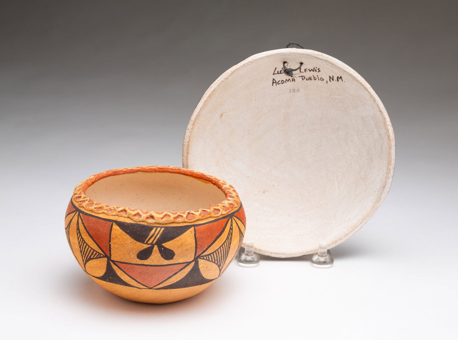 LUCY LEWIS (ACOMA PUEBLO, 1890-1992) POLYCHROME-DECORATED POTTERY INVERTED BOWL AND AN ACOMA JAR. (1 of 3)