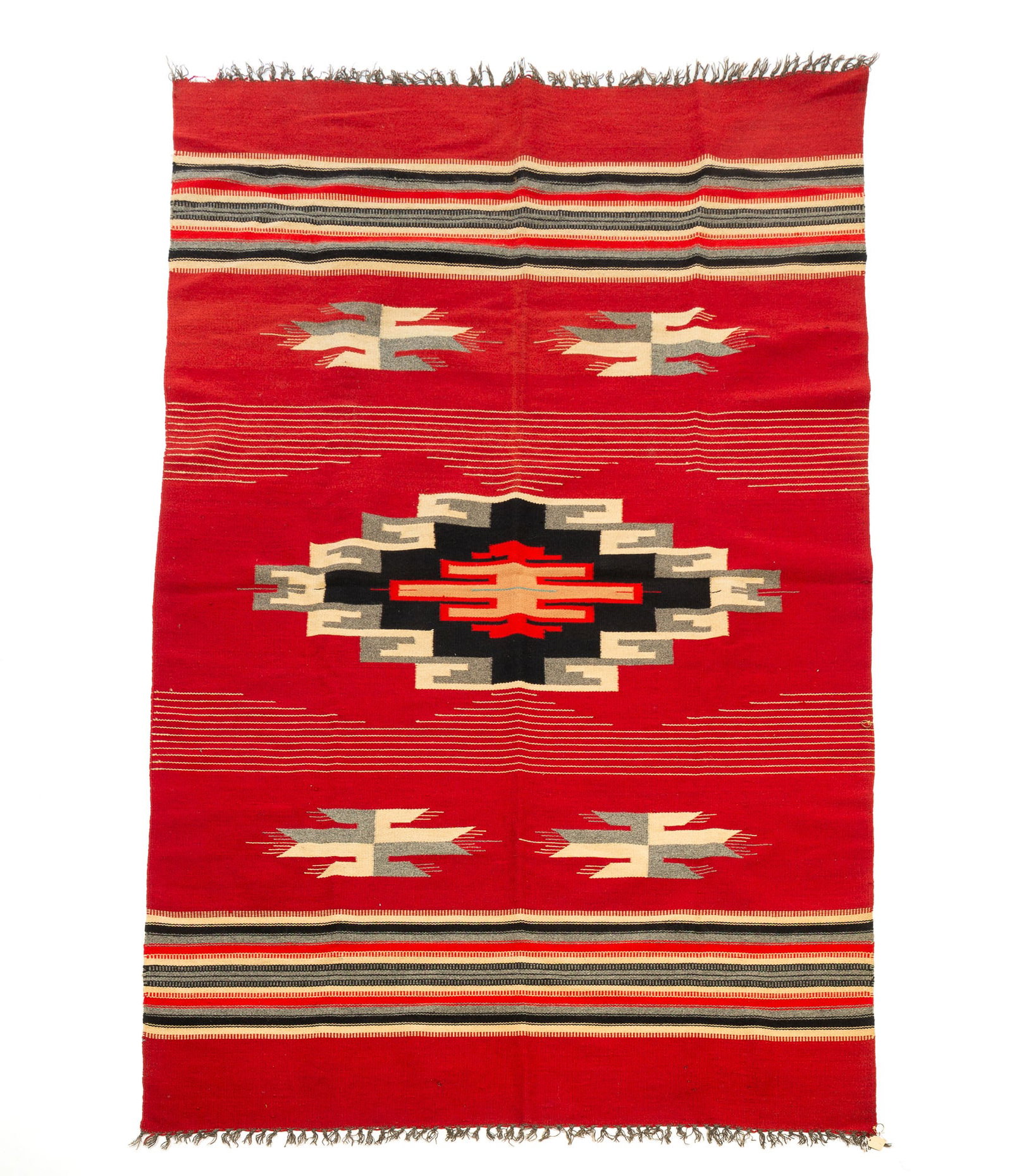 CHIMAYO/MEXICAN SOUTHWESTERN WOOL RUG.: CHIMAYO/MEXICAN SOUTHWESTERN WOOL RUG. 20th Century. A red field with red, black, and white stripes and a central geometric medallion. 51"w. 80"l. Provenance: From the Lifetime Collection of the late