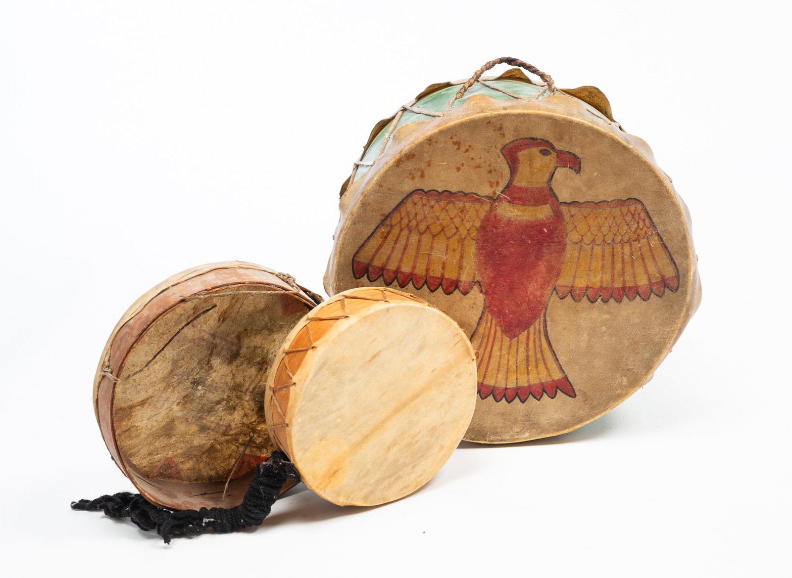 THREE NATIVE AMERICAN HIDE-COVERED DRUMS. - 2