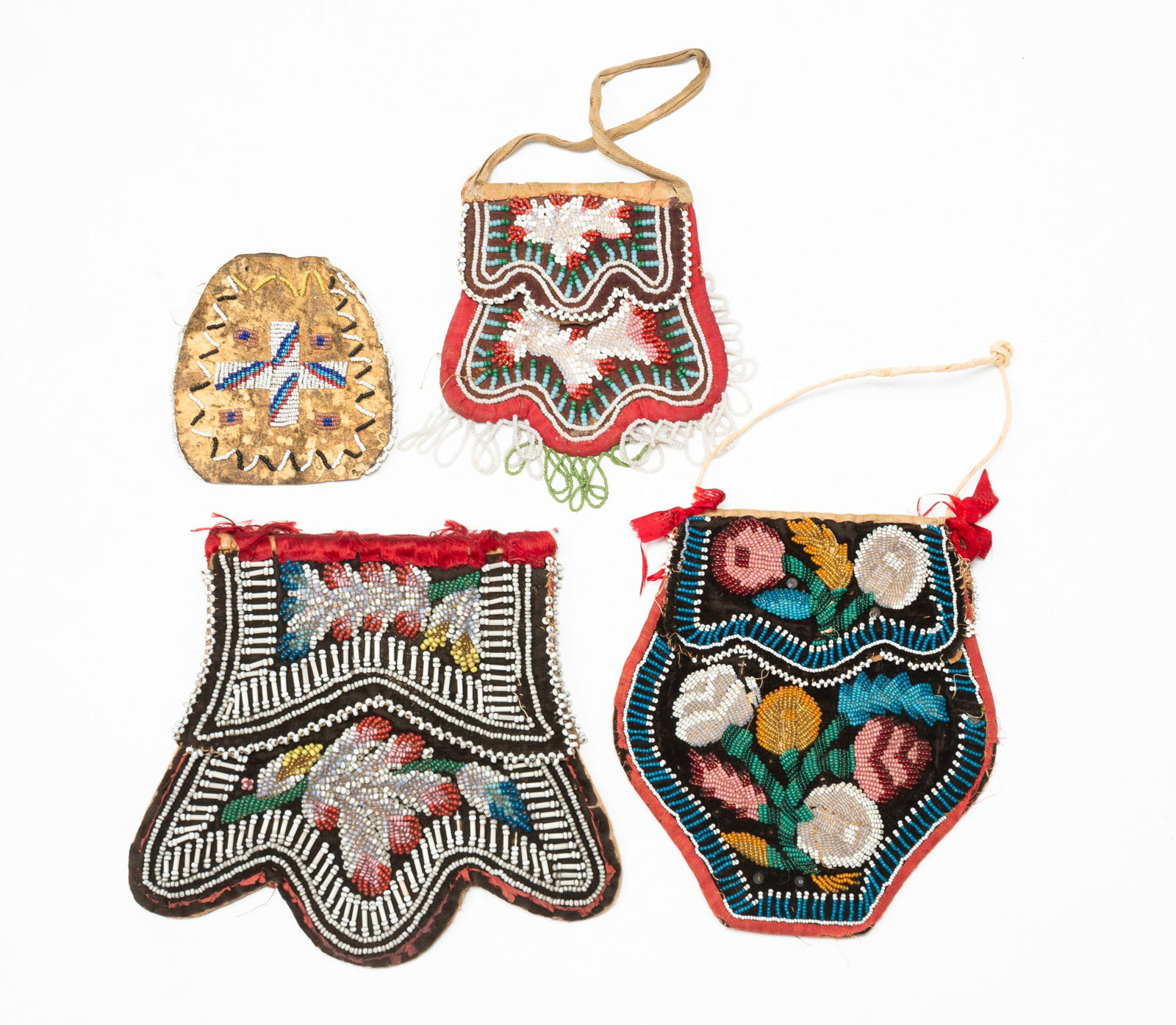 FOUR NATIVE AMERICAN BEADED POUCHES. (1 of 6)