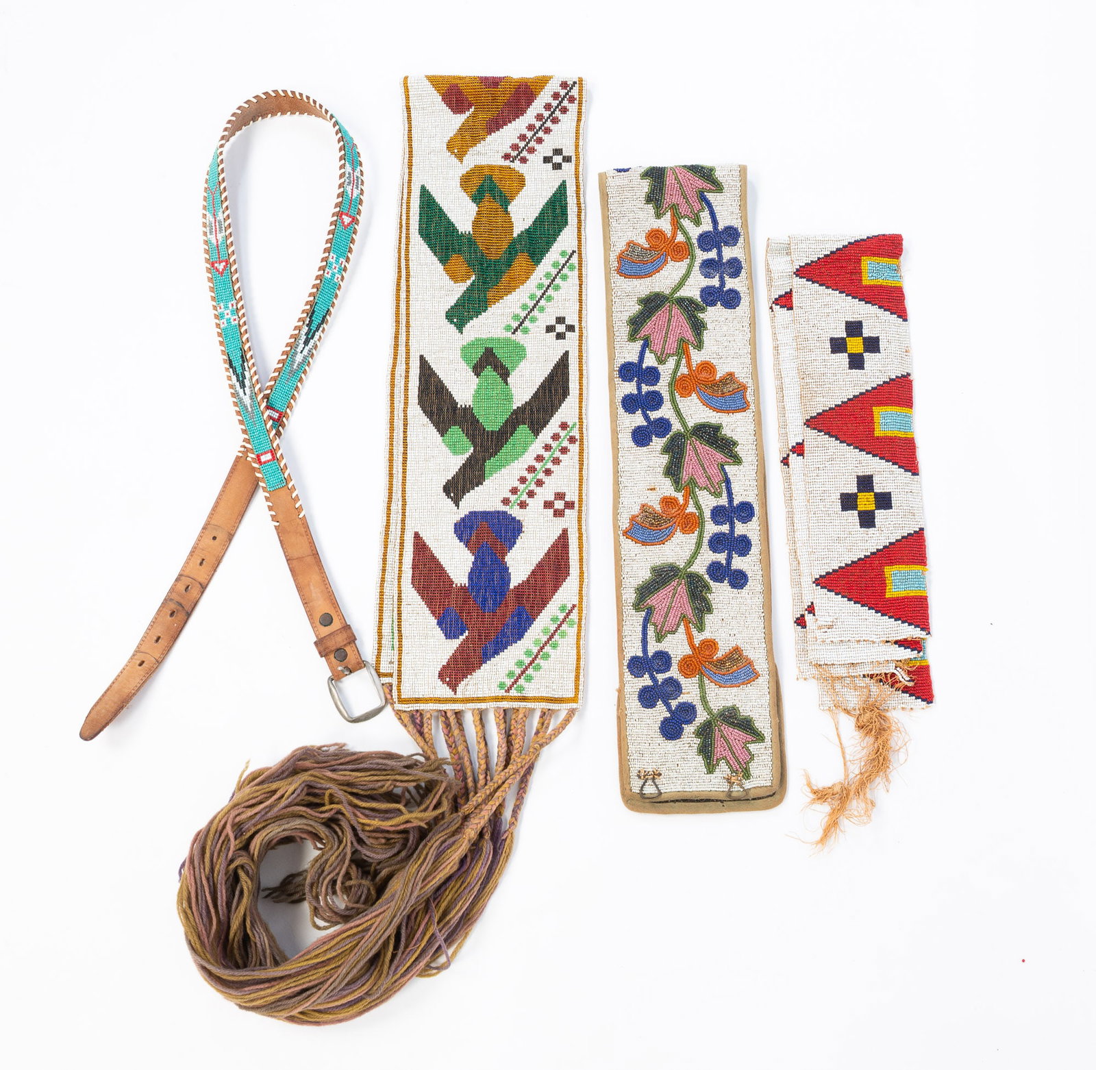 FIVE NATIVE AMERICAN BEAD WORK BELTS AND SASHES.: FIVE NATIVE AMERICAN BEAD WORK BELTS AND SASHES. 20th Century. Fringed sash with multi-colored birds and flowering branches, 5.75"w. 39"l. plus fringe. Two sashes with multi-colored geometric