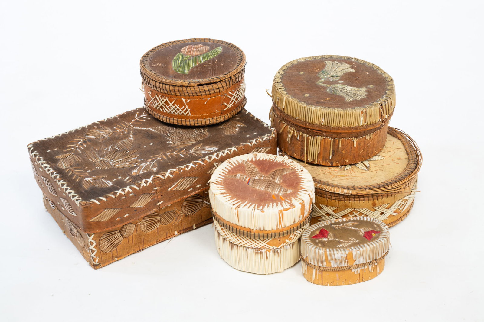 SIX NATIVE AMERICAN PORCUPINE QUILL AND BARK BOXES.: SIX NATIVE AMERICAN PORCUPINE QUILL AND BARK BOXES. Late 19th-early 20th Century. Decorated throughout in various motifs with porcupine quills. Largest, 3.25"h. 8.5"w. 3.25"h. 8.5"w.