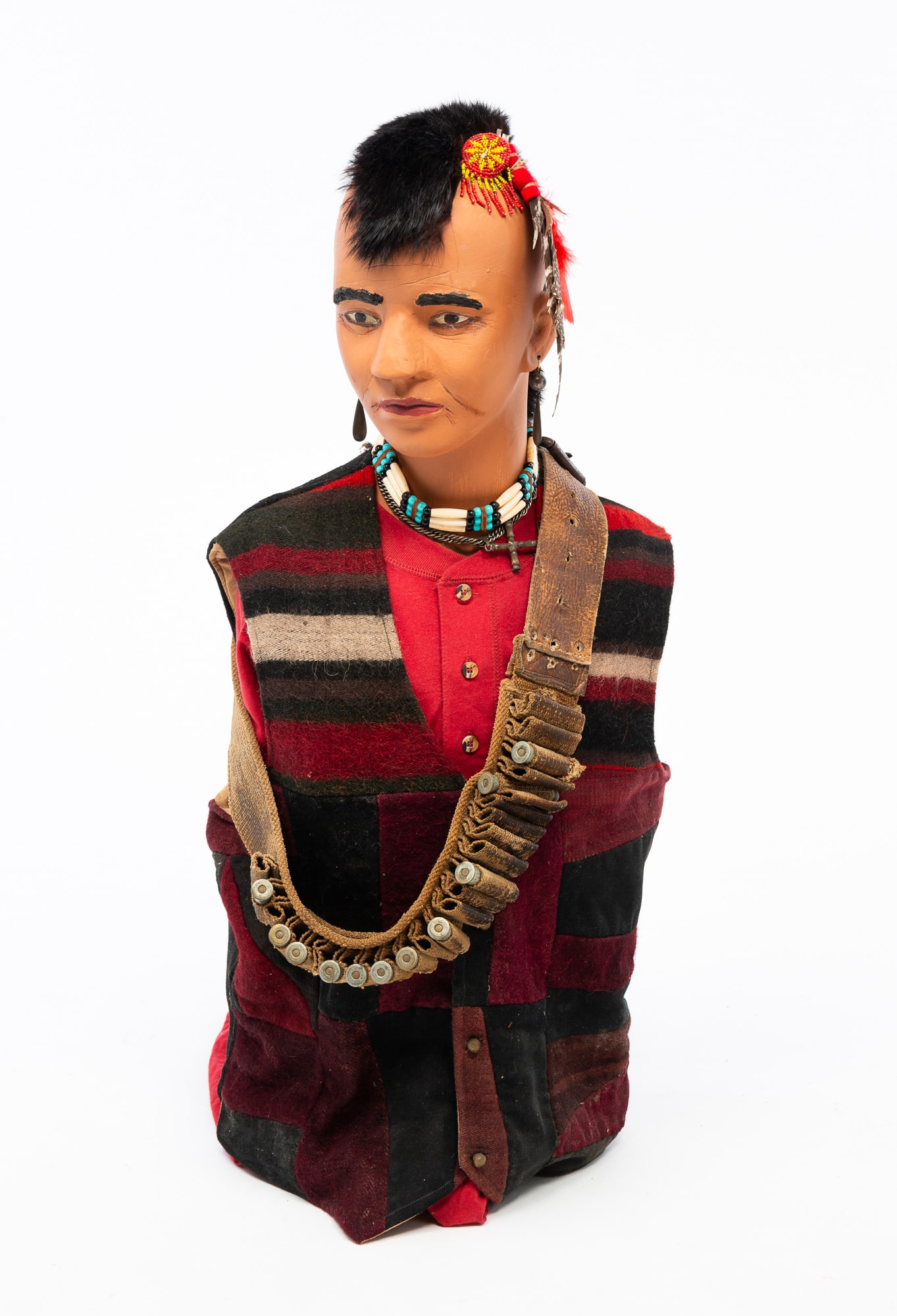 NATIVE AMERICAN CLOTHING AND MILITARY ACCESSORIES.: NATIVE AMERICAN CLOTHING AND MILITARY ACCESSORIES. American, 19th-20th Century. Includes earrings, a beaded necklace, a cross necklace, a red shirt, a wool vest, as well as a khaki canvas and brown