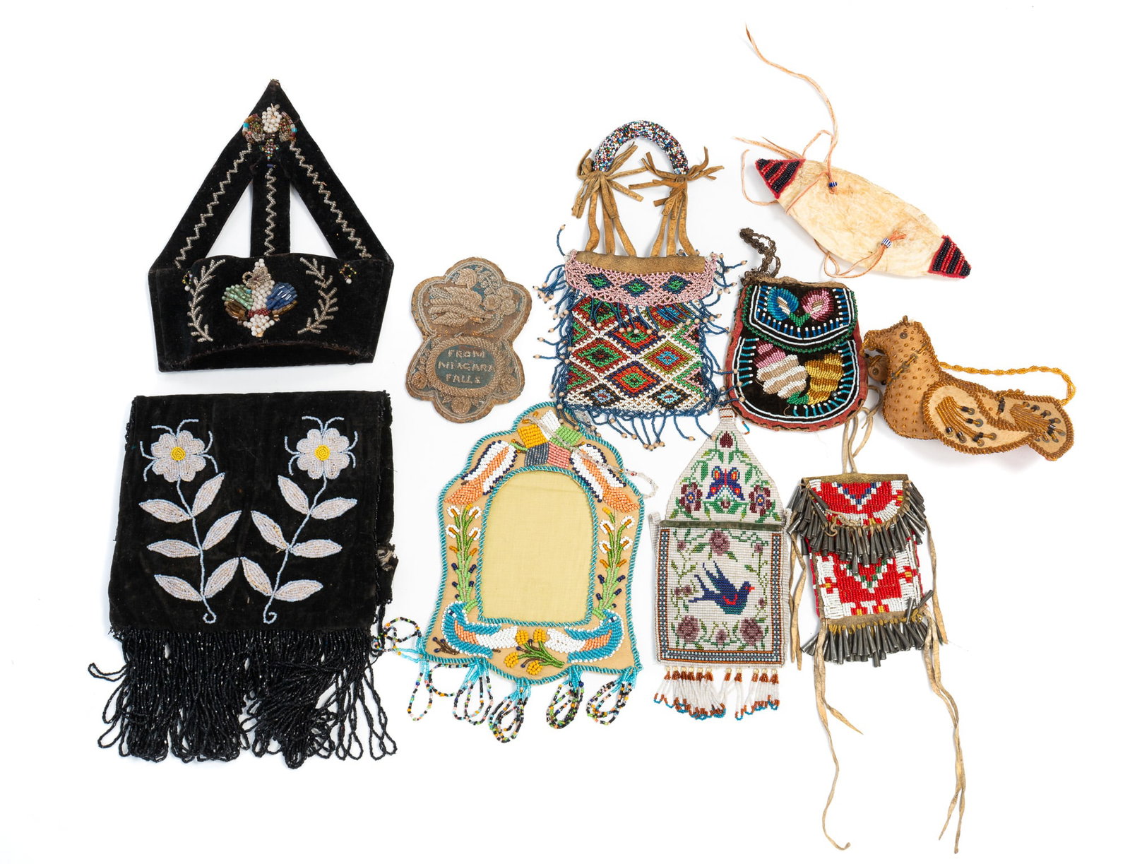 GROUP OF NATIVE AMERICAN BEAD WORK.: GROUP OF NATIVE AMERICAN BEAD WORK. Late 19th-early 20th Century. A black velvet pouch with floral beading and fringe, 20"h. 8.75"w. A black velvet wall pocket with floral beading and zig-zag trim,
