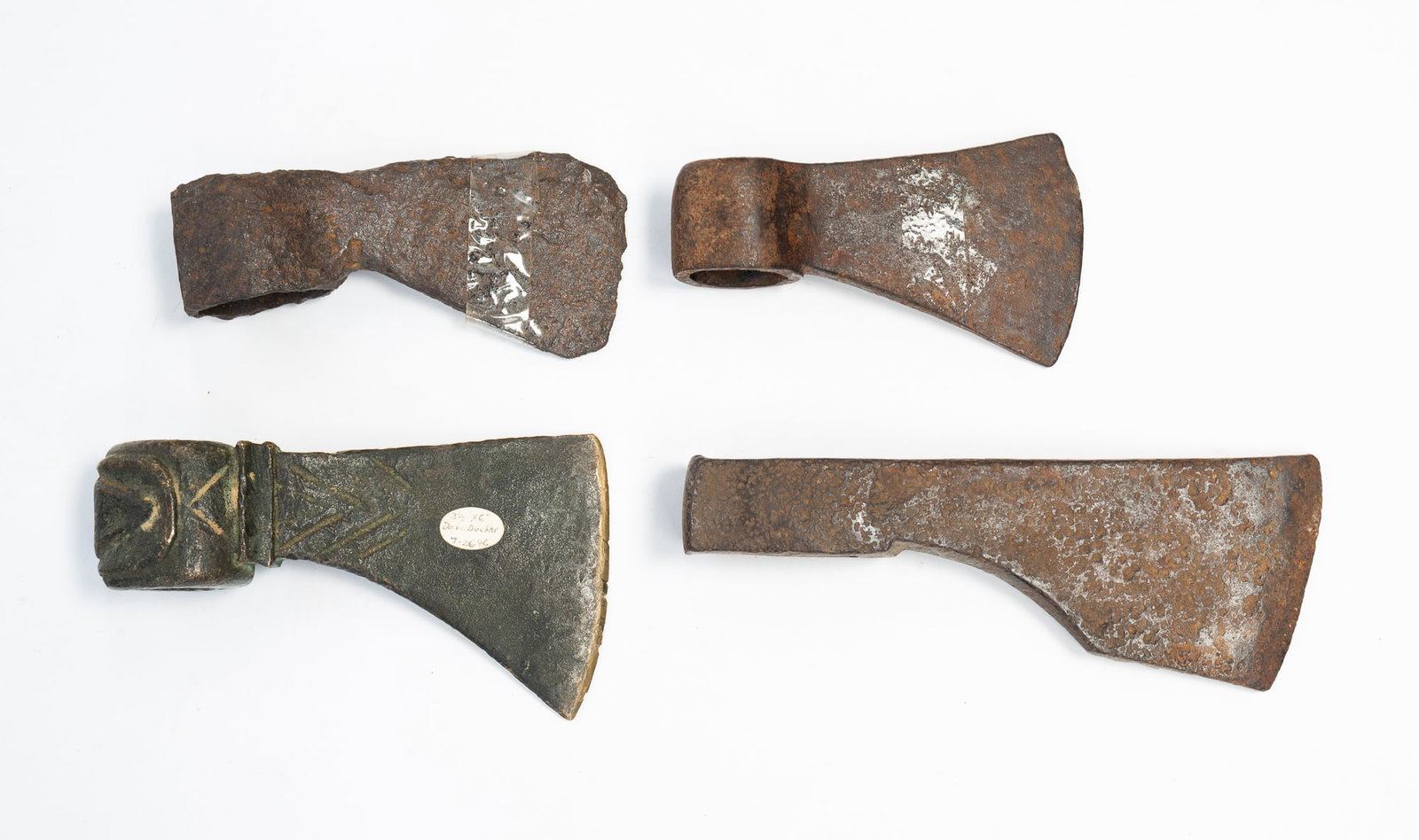 FOUR AMERICAN IRON AND BRASS TRADE AXES. (1 of 3)