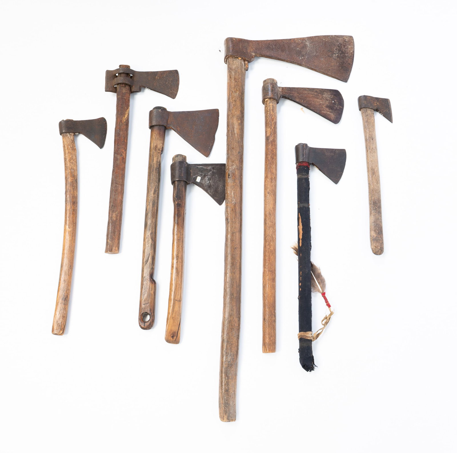 EIGHT HAND-FORGED IRON AND WOOD-HANDLED AXES. (1 of 6)