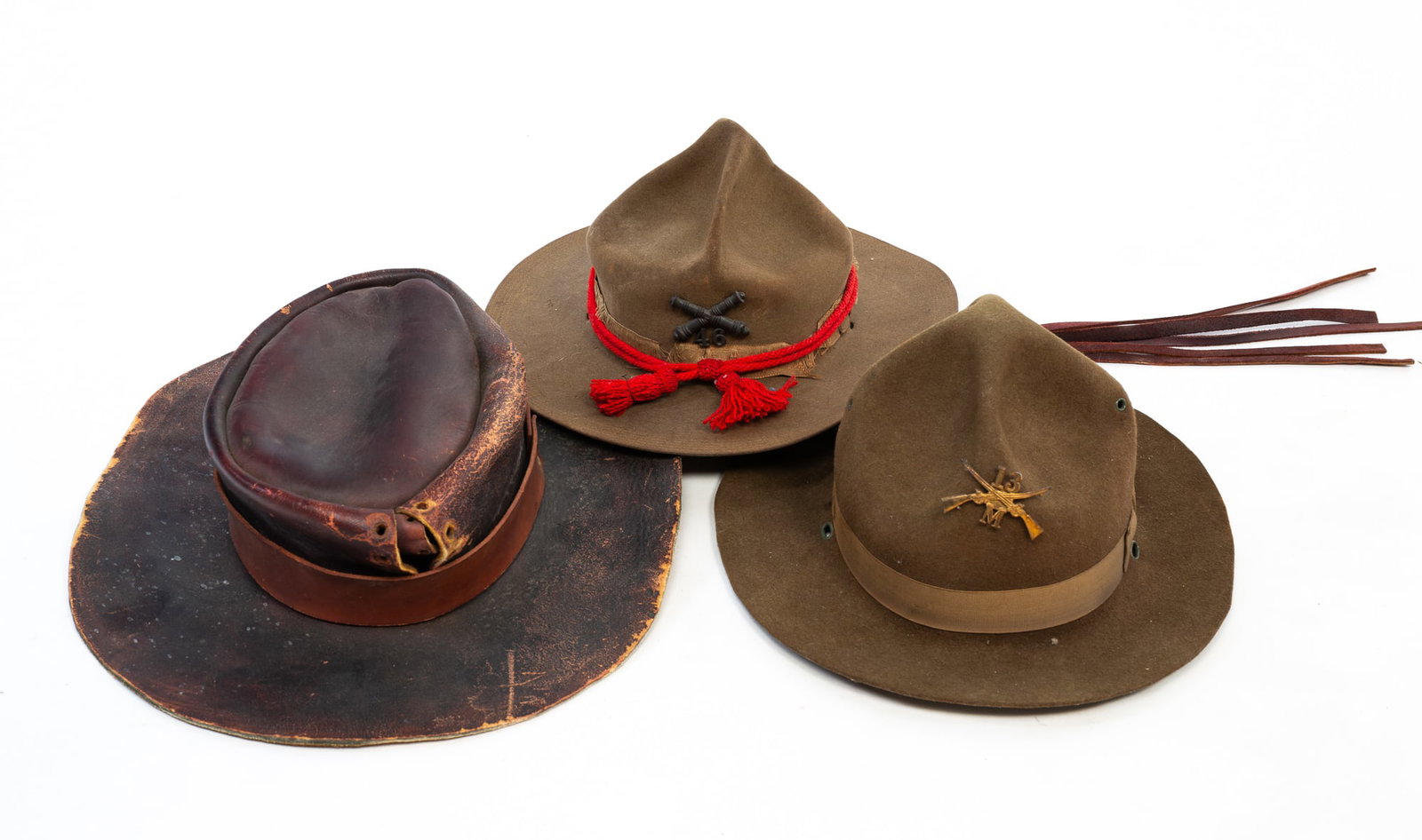TWO U.S. CAVALRY FELT HATS AND A LEATHER COWBOY HAT. (1 of 5)