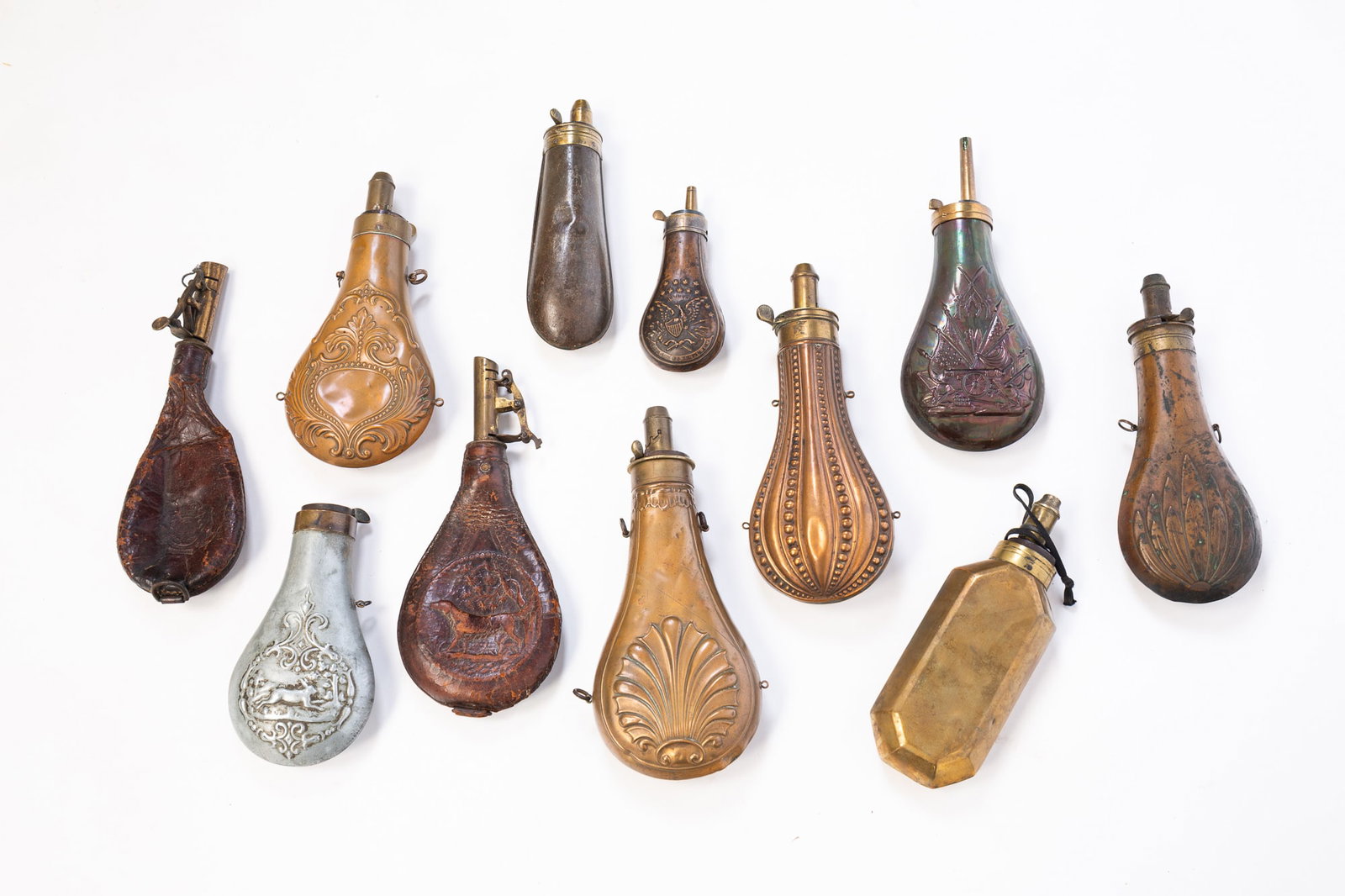 ELEVEN CIVIL WAR ERA GUN POWDER FLASKS. (1 of 6)