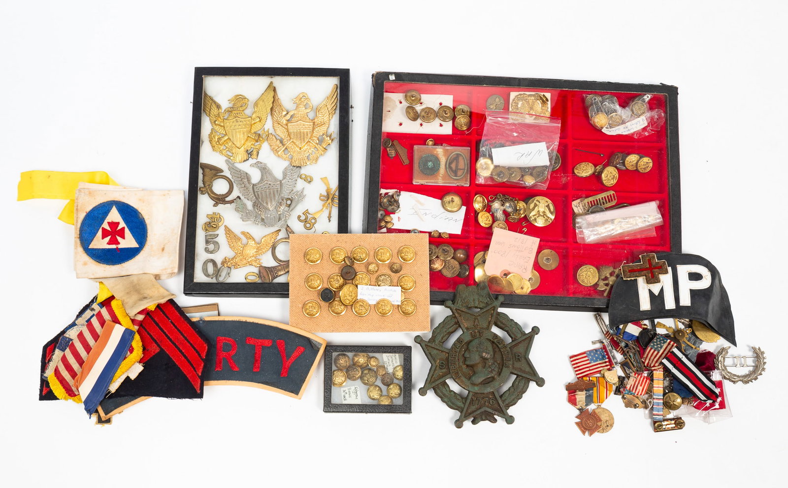 GROUP OF MILITARY BUTTONS, MEDALS, AND HELMET PLATES. (1 of 5)