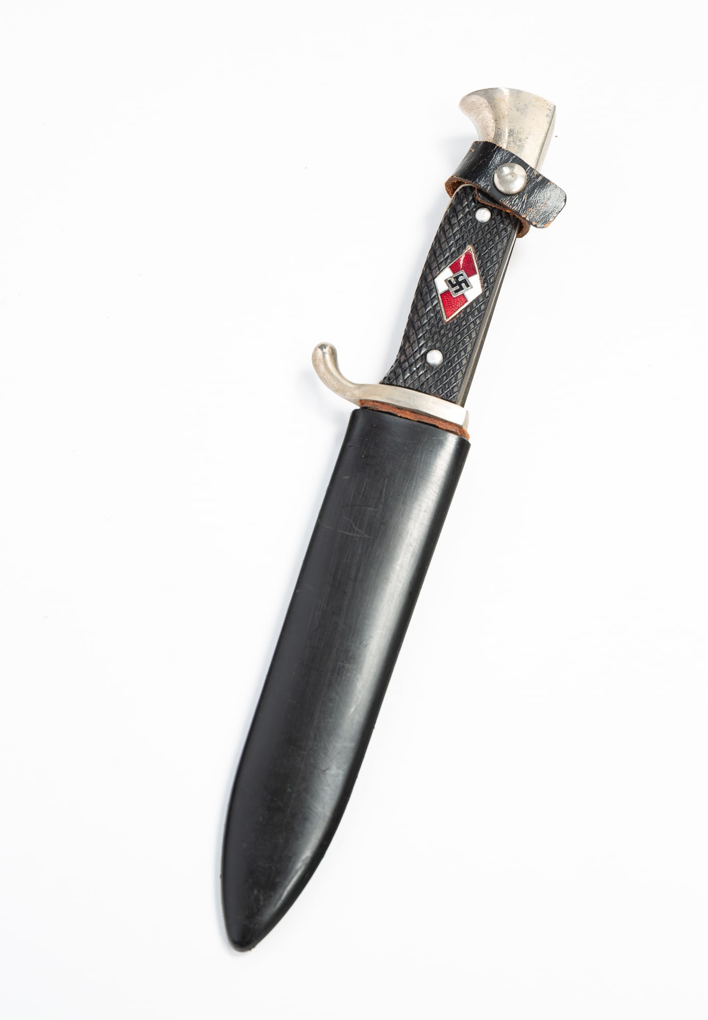 GERMAN WWII SOLINGEN YOUTH MILITARY DAGGER WITH SCABBARD.: GERMAN WWII SOLINGEN YOUTH MILITARY DAGGER WITH SCABBARD. Mid-20th Century. Steel handle with black composite grip having an enameled swastika, the tang marked "F.A. Bower Imp. Co. Germany." Leather a