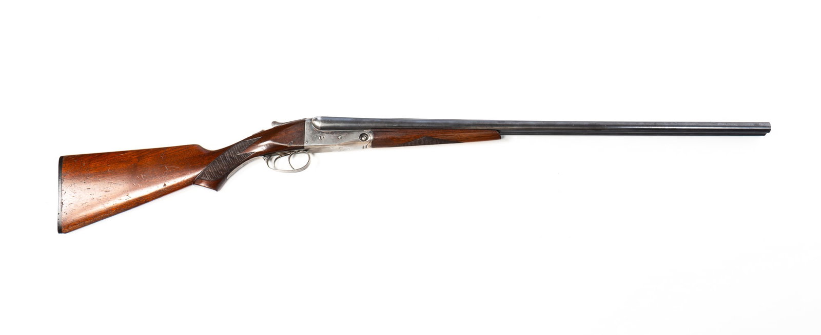 PARKER BROTHERS SIDE BY SIDE 20-GAUGE SHOTGUN.: PARKER BROTHERS SIDE BY SIDE 20-GAUGE SHOTGUN. American, Mid-20th Century. Serial number 227695. Walnut stock with checkered forearm and wrist, break action, and Trojan Steel barrel. 44"l. *FFL