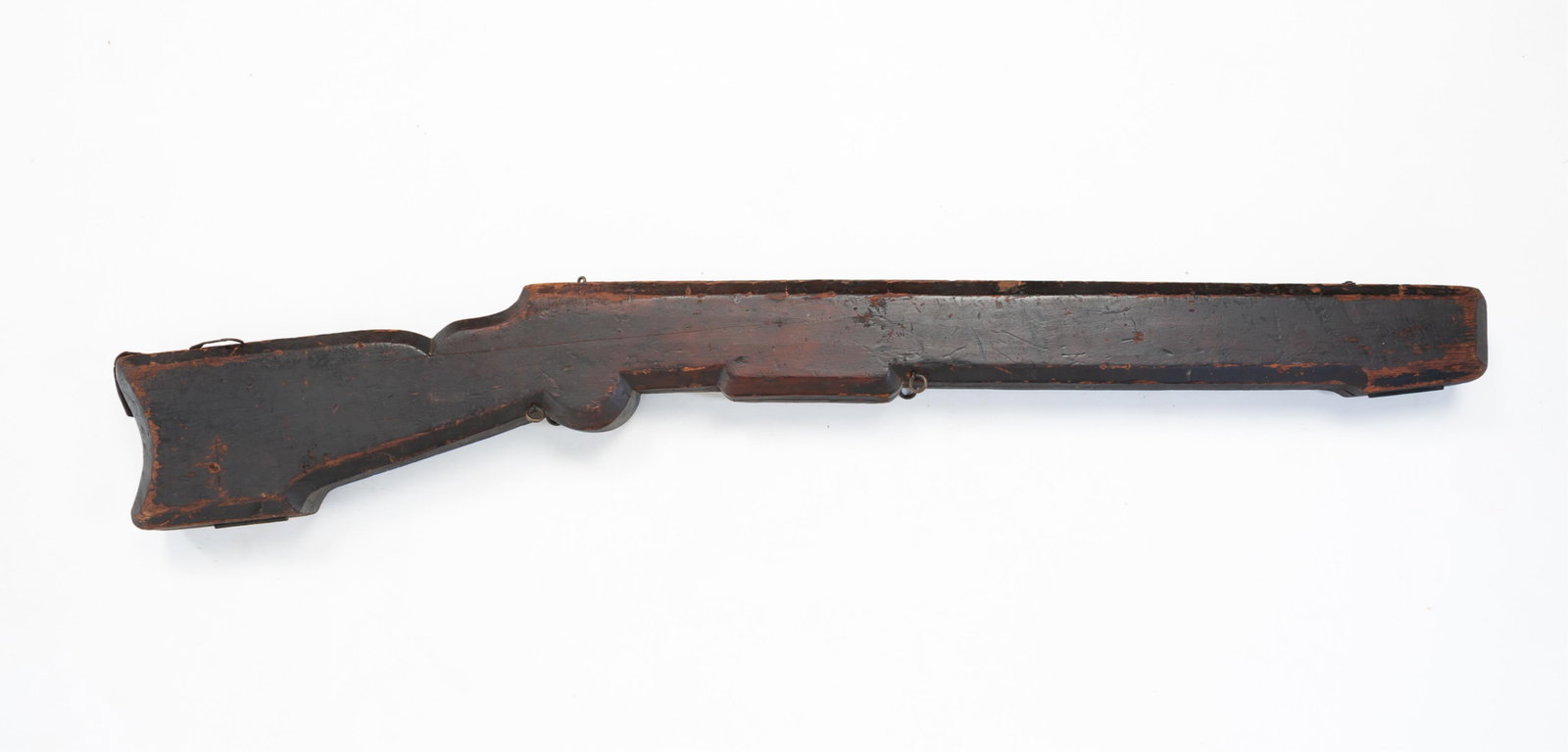 AMERICAN HOMEMADE PINE RIFLE CASE.: AMERICAN HOMEMADE PINE RIFLE CASE. Mid-19th Century. Hollowed out single piece of wood with old dark finish and brass hardware. 45.5"l. 45.5"l.