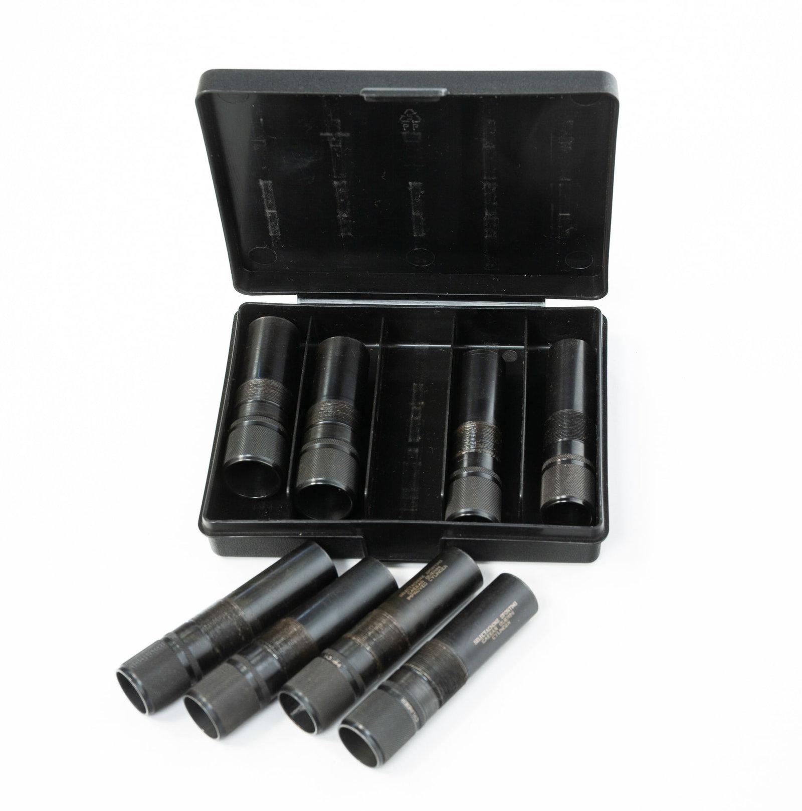 EIGHT CAESAR GUERINI CHOKE TUBES.: EIGHT CAESAR GUERINI CHOKE TUBES. Italian, Contemporary. In two plastic cases, six 20-gauge extended chokes and two 12-gauge extended chokes. With threaded barrels. One box, 1"h. 5"w. 1"h. 5"w.