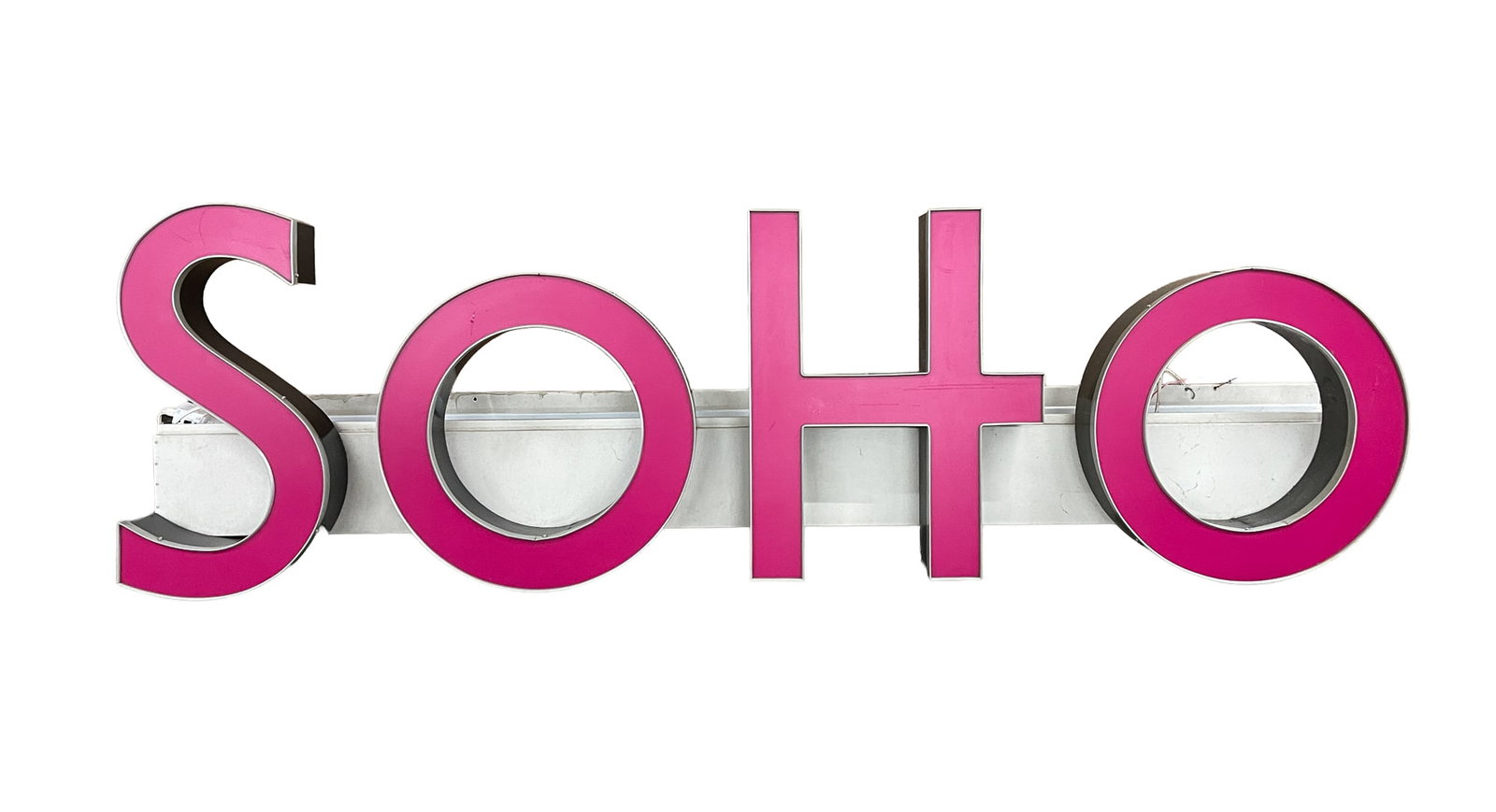 LIGHTED "SOHO" SIGN.: LIGHTED "SOHO" SIGN. American, mid to late 20th Century. A lighted sign reading "SOHO" having magenta and black letters with silver trim on a white ground. 29.5"h. 96"w. 13.5"d. Provenance: From the l