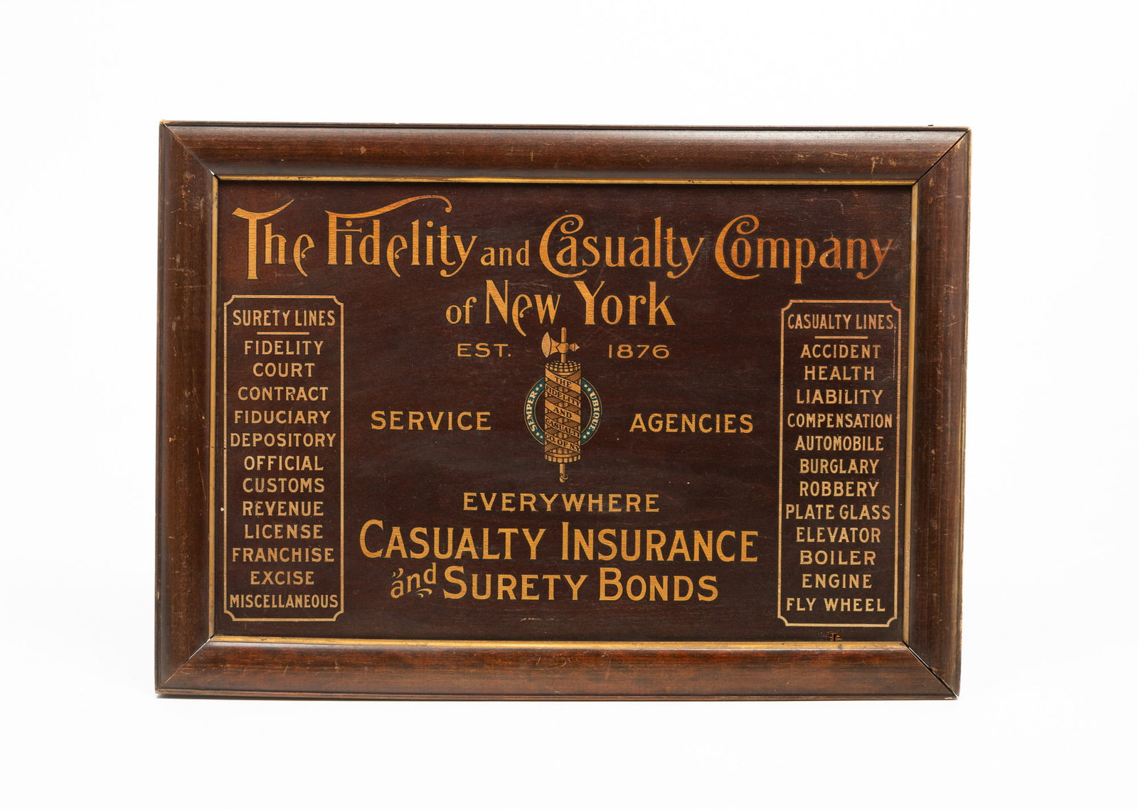 AMERICAN FIDELITY AND CASUALTY INSURANCE ADVERTISING SIGN.: AMERICAN FIDELITY AND CASUALTY INSURANCE ADVERTISING SIGN. First quarter 20th Century. Plywood. Nicely lettered in gold, listing surety and casualty lines. Framed, 19.75"h. 27.5"w. Provenance: From