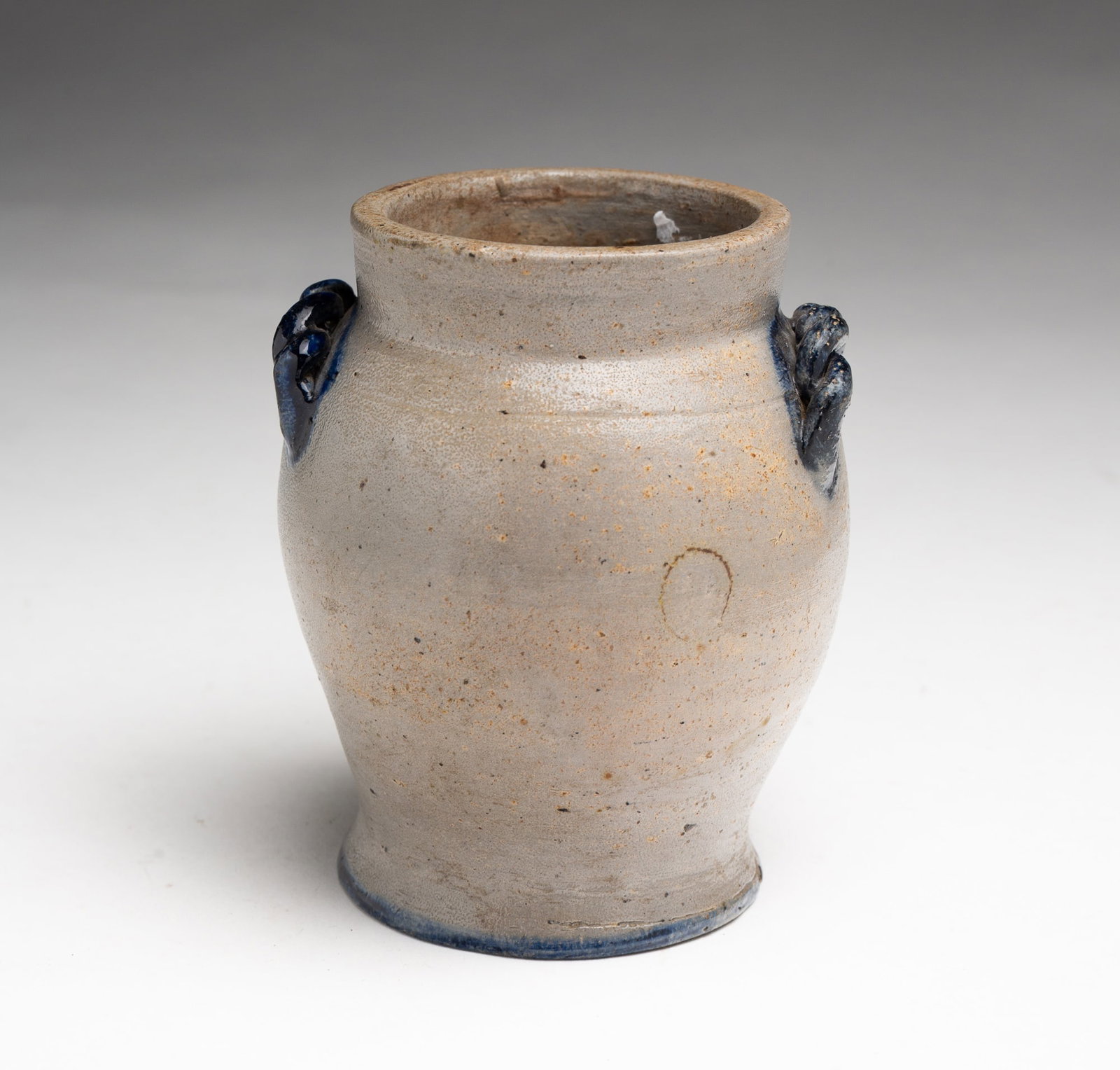 MINIATURE JAMES HAMILTON (GREENSBORO, PENNSYLVANIA) COBALT-DECORATED STONEWARE JAR.: MINIATURE JAMES HAMILTON (GREENSBORO, PENNSYLVANIA) COBALT-DECORATED STONEWARE JAR. American, 19th Century. Ovoid shape with straight lip and flared base, rope handles, freehand cobalt decoration on h