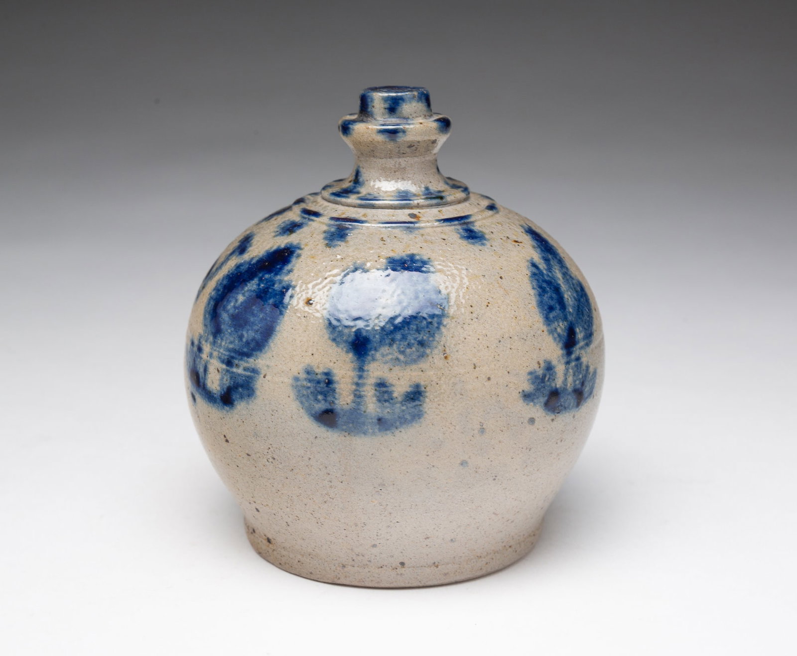 RARE AND FINE MINIATURE NEW JERSEY COBALT-DECORATED STONEWARE BANK, INSCRIBED "NJ.": RARE AND FINE MINIATURE NEW JERSEY COBALT-DECORATED STONEWARE BANK, INSCRIBED "NJ." American, Early to mid-19th Century. Having a unique, cylindrical finial above a tooled shoulder with carved, vertic