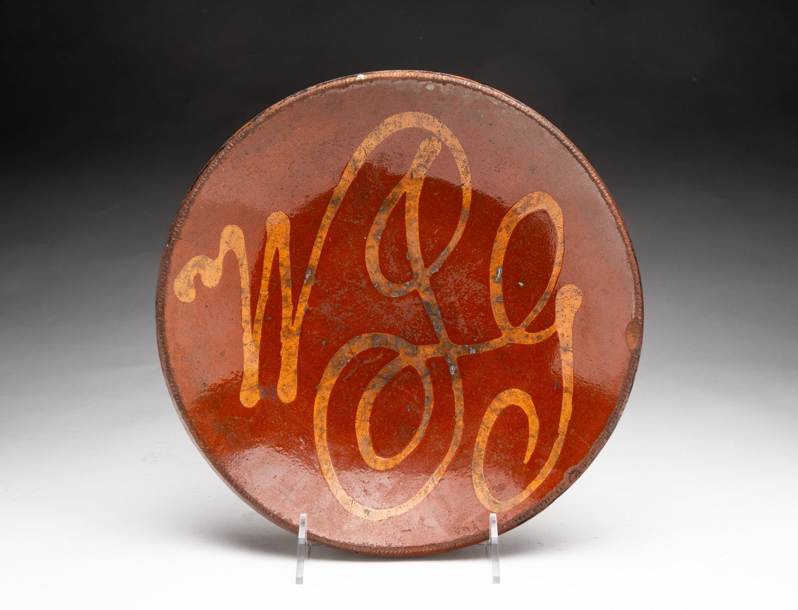 LANCASTER, PENNSYLVANIA SLIP-DECORATED REDWARE PIE PLATE WITH MONOGRAM. (1 of 3)