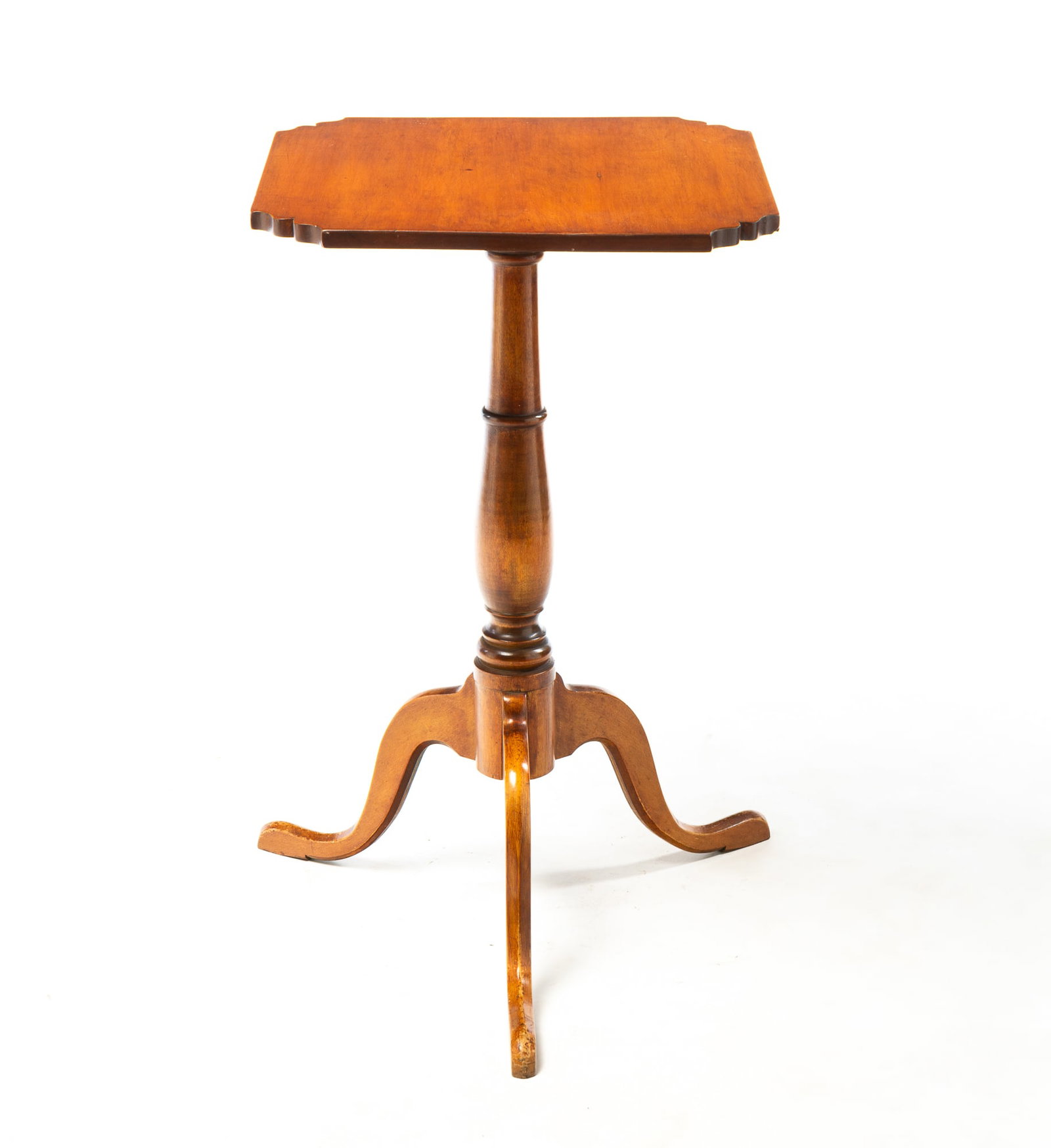 CHERRY CANDLESTAND.: CHERRY CANDLESTAND. American, Early 19th Century. Square top with shaped corners, turned columns, and snake legs with pad feet. 26.75"h. 16.25"d. Provenance: From the Lifetime Collection of Charles