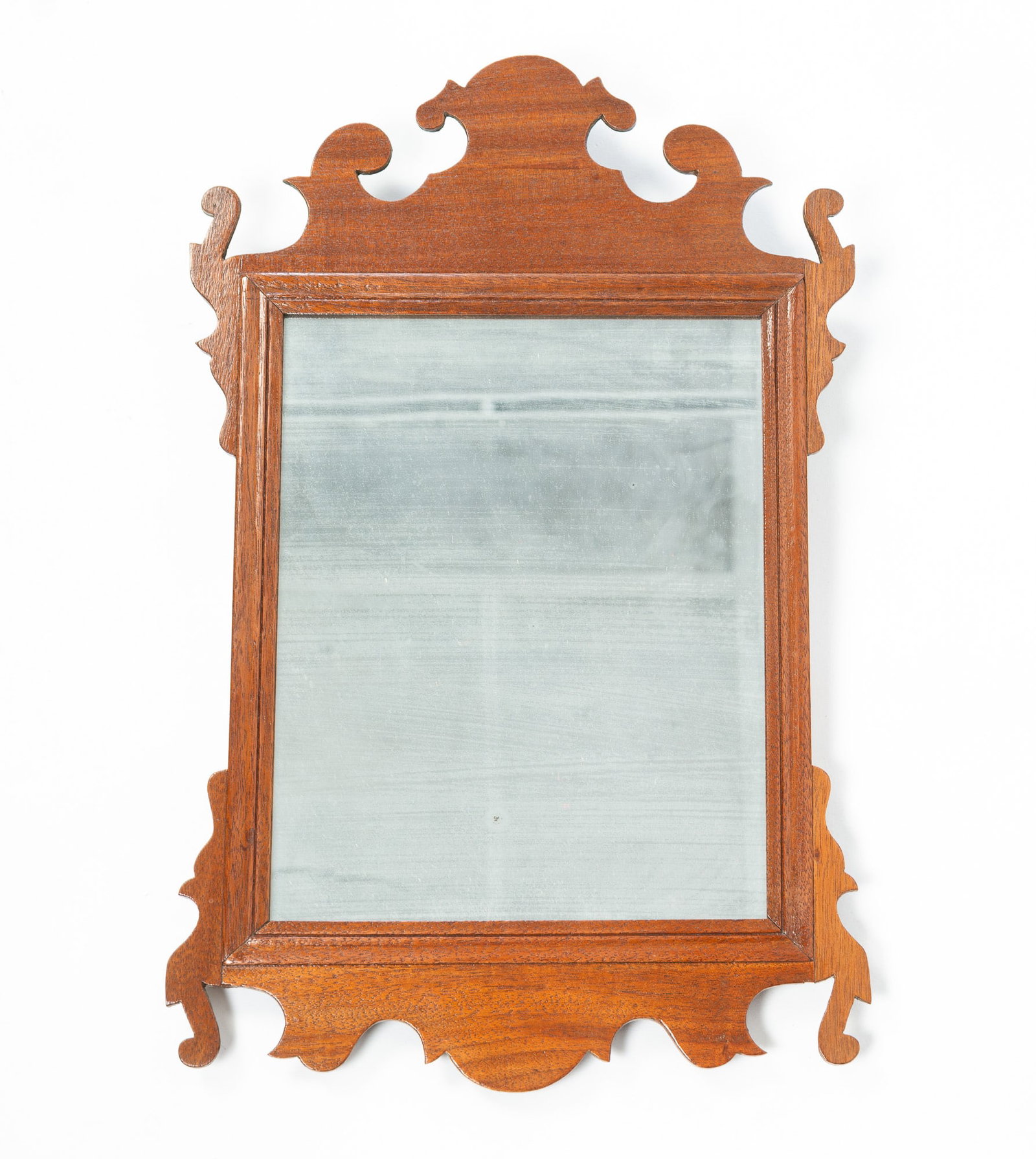 DIMINUTIVE CHIPPENDALE SCROLL MIRROR.: DIMINUTIVE CHIPPENDALE SCROLL MIRROR. American, Late 18th Century. Mahogany and Pine. Nicely shaped scrolling, line inlay. And old mirror with some foxing. 18"h. 11.5"w. Provenance: From the Lifetime 
