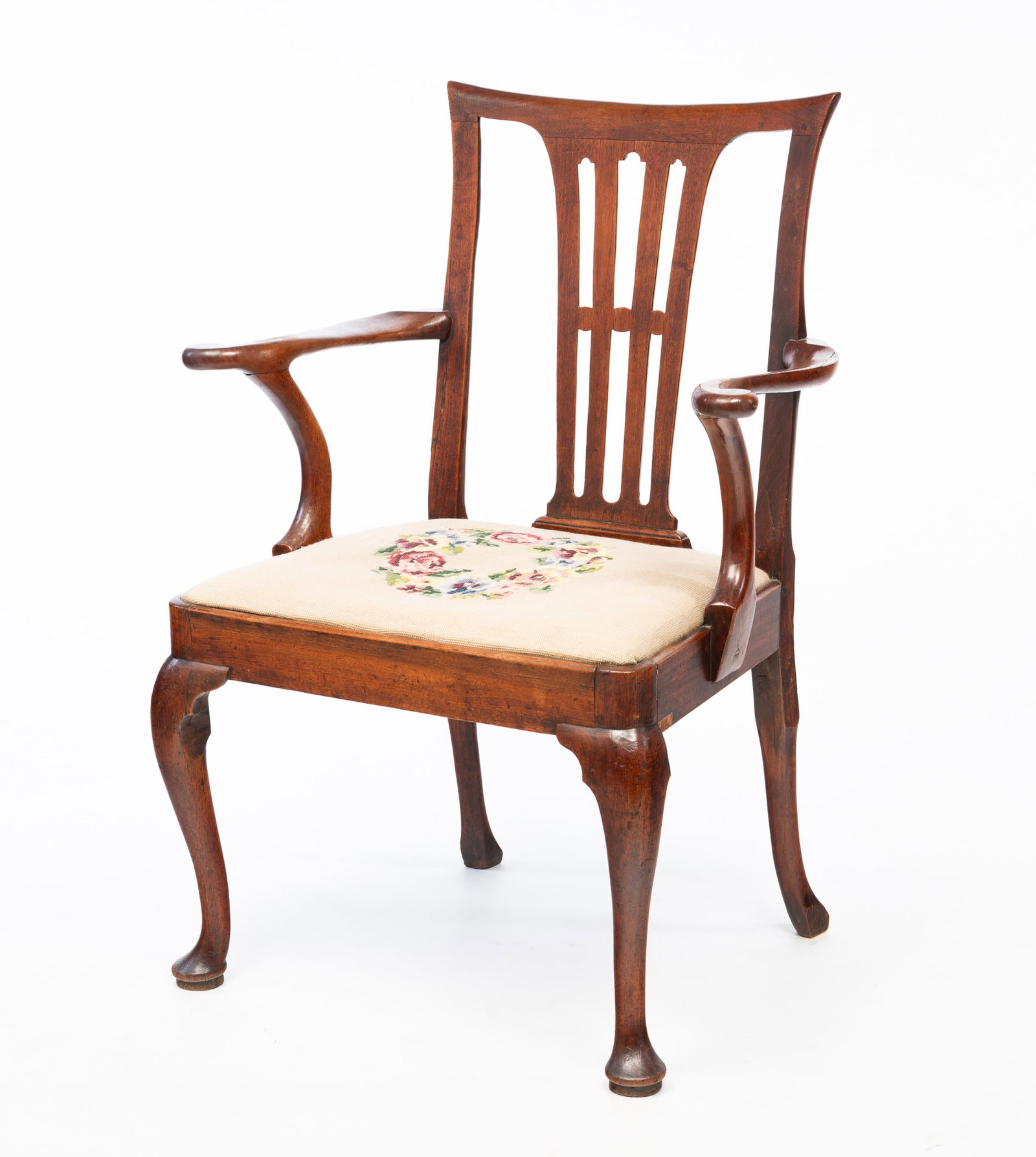 MAHOGANY AND NEEDLEPOINT ARMCHAIR.: MAHOGANY AND NEEDLEPOINT ARMCHAIR. English, Mid-late 18th Century. Concave curved crest, pierced splat, scrolled arms, curved stiles, cabriole front legs with pad feet and curved back legs. Needlepoin