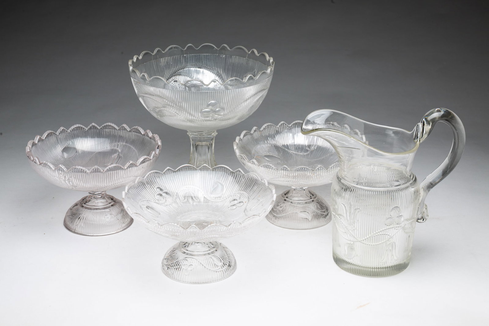 FOUR BELLFLOWER PATTERN FLINT GLASS COMPOTES AND PITCHER. (1 of 5)