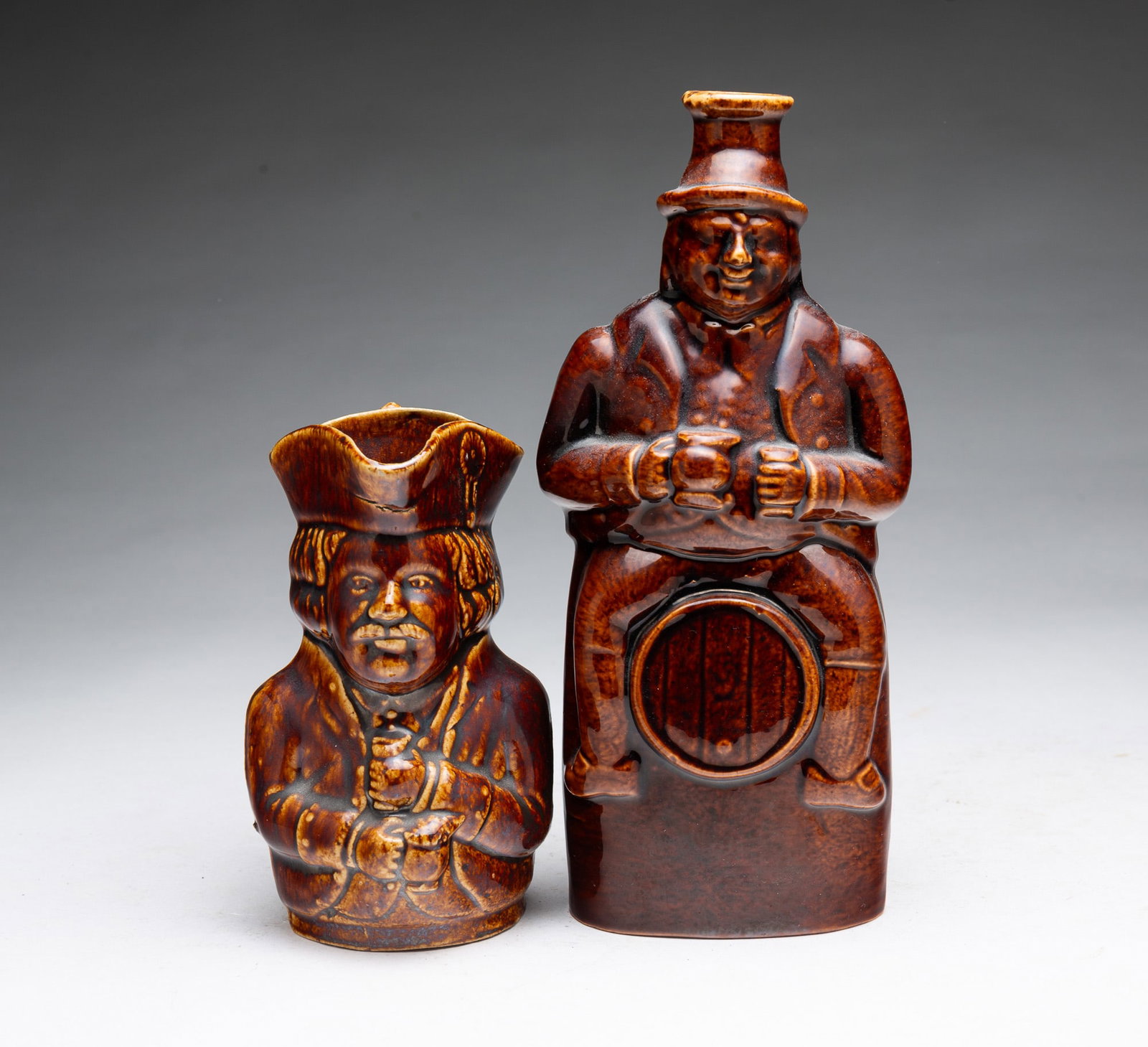 ROCKINGHAM GLAZED FIGURAL FLASK AND TOBY JUG. (1 of 5)
