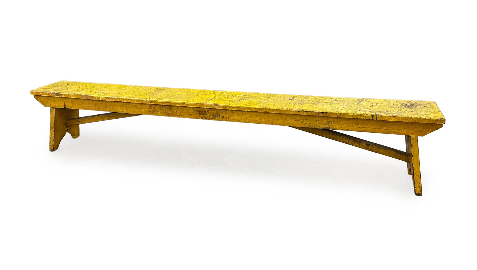 YELLOW-PAINTED COUNTRY BENCH.: YELLOW-PAINTED COUNTRY BENCH. American, 20th Century. Hardwood. One board top, front, and back battens, canted legs with boot jack ends, diagonal supports. Later paint. 16.5"h. 94"w. 11"d.