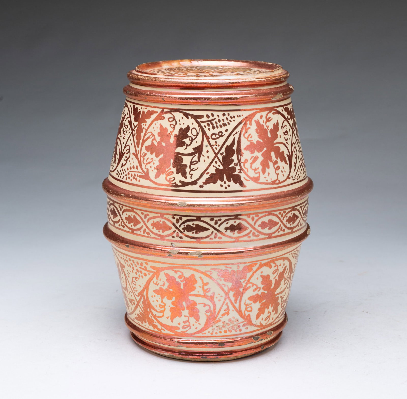 HISPANO-MORESQUE LUSTERWARE BARREL.: HISPANO-MORESQUE LUSTERWARE BARREL. Likely Spain, 19th Century. Having a barrel form with luster bands, with luster geometric patterns on lid and underside, the sides with foliate and grape motifs.