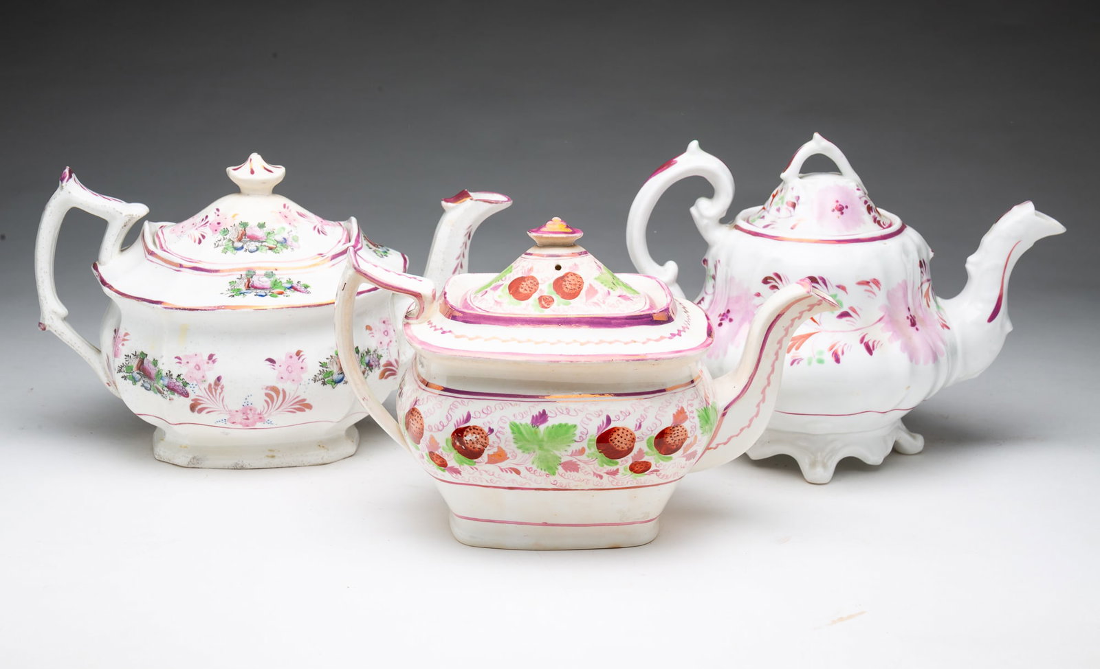 THREE PINK LUSTERWARE TEAPOTS. - 2