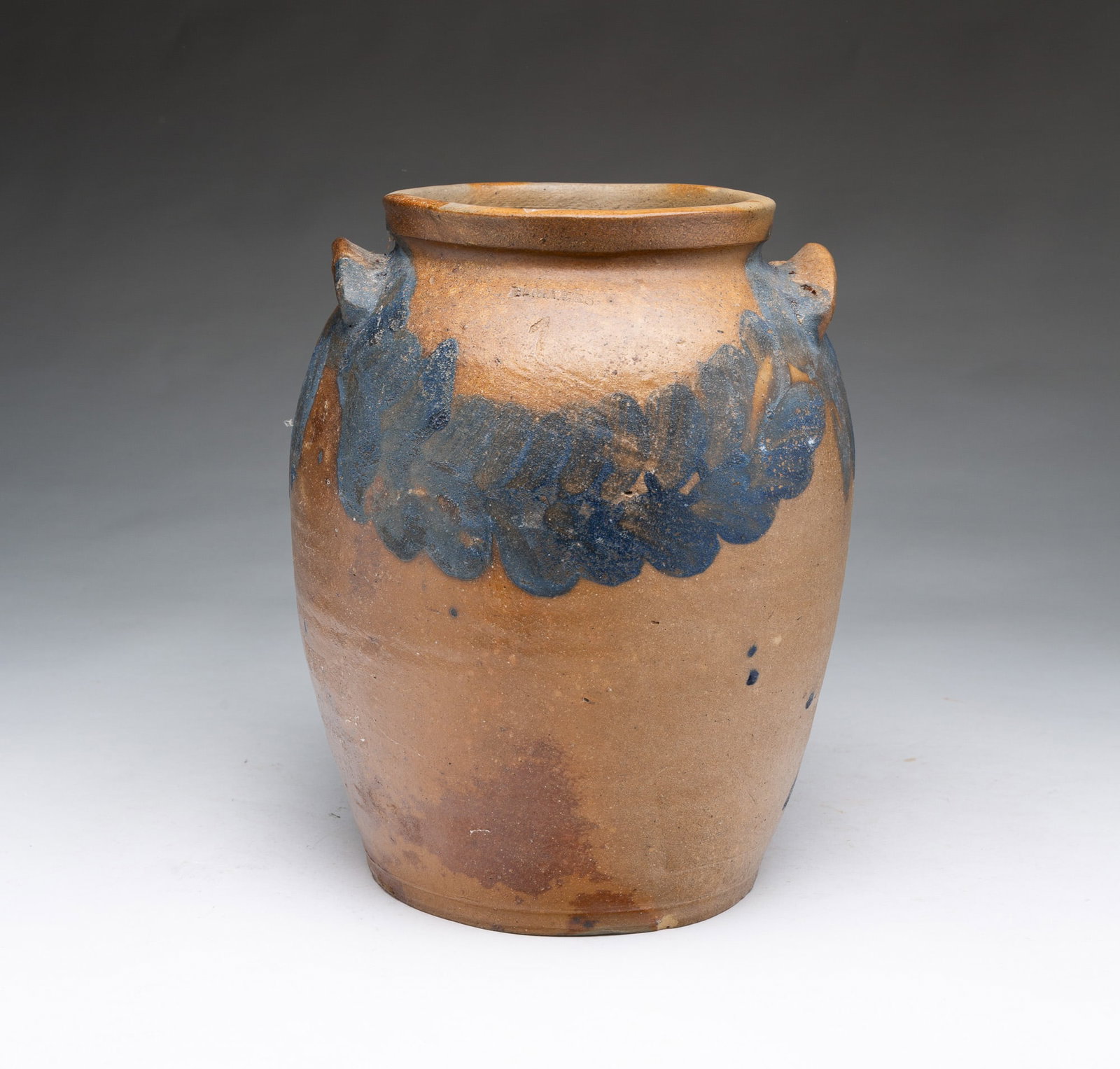 H. MYERS (BALTIMORE, MARYLAND) COBALT-DECORATED TWO-HANDLED ONE-GALLON STONEWARE JAR.: H. MYERS (BALTIMORE, MARYLAND) COBALT-DECORATED TWO-HANDLED ONE-GALLON STONEWARE JAR. American, 19th Century. Of ovoid form with pronounced and slightly flared top rim and two lug handles. Thickly bru