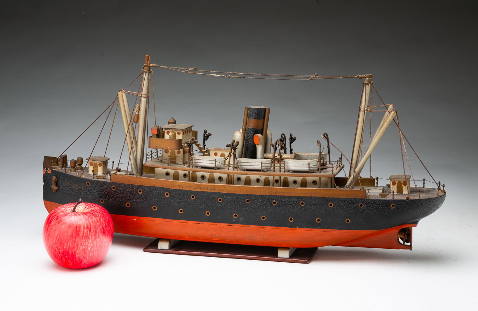 FINELY DETAILED FOLK ART PAINTED STEAMSHIP MODEL OF THE S.S. BEAR.: FINELY DETAILED FOLK ART PAINTED STEAMSHIP MODEL OF THE S.S. BEAR. American, 20th Century. Wood and metal. Polychrome-painted passenger and cargo ship with smokestacks, dinghies, and masts on upper