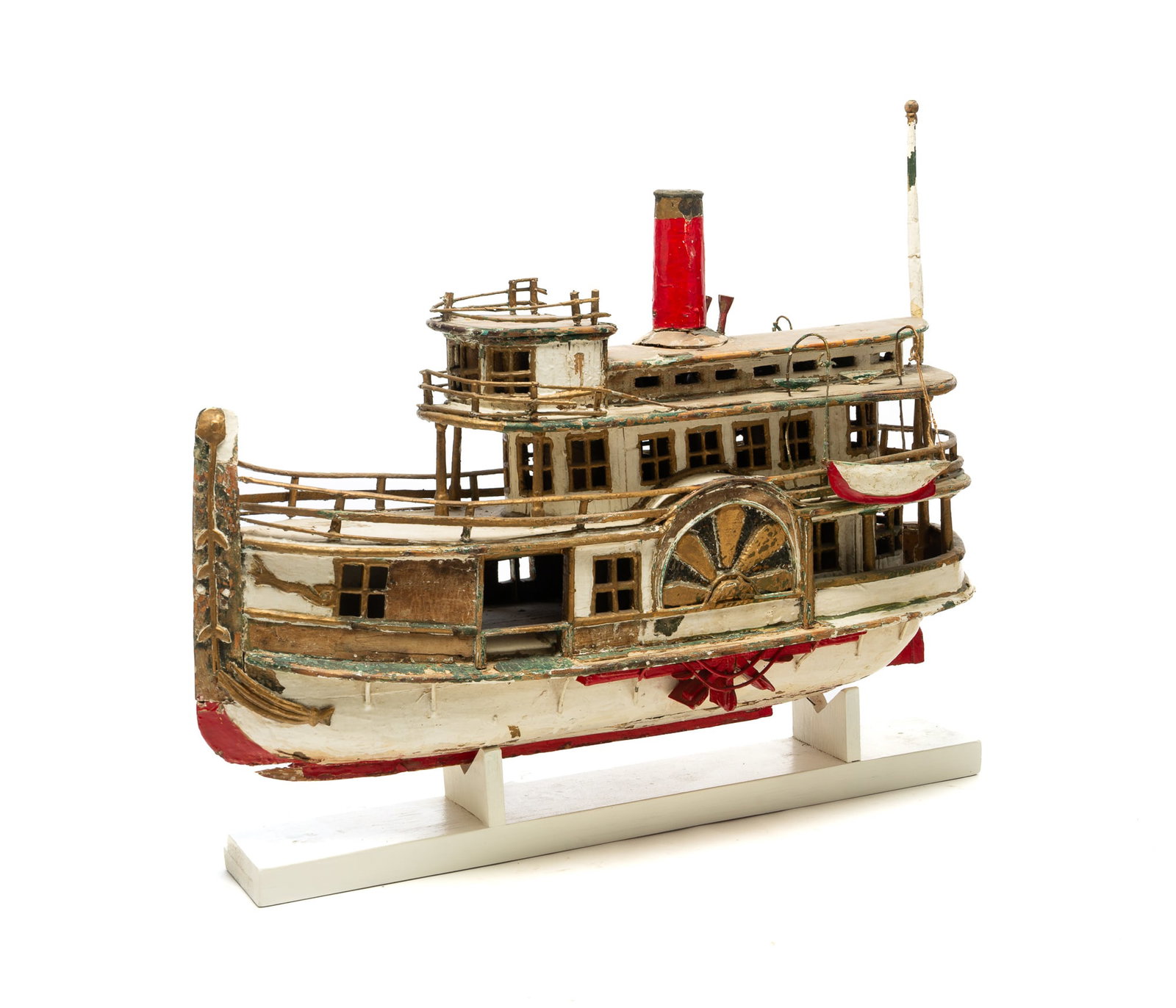 FOLKSY SIDE WHEEL STEAMBOAT MODEL.: FOLKSY SIDE WHEEL STEAMBOAT MODEL. American, Early 20th Century. East Coast style passenger boat, high stem piece, decorated wheelhouses, boiler deck with enclosed cabin, hurricane deck, skylight,