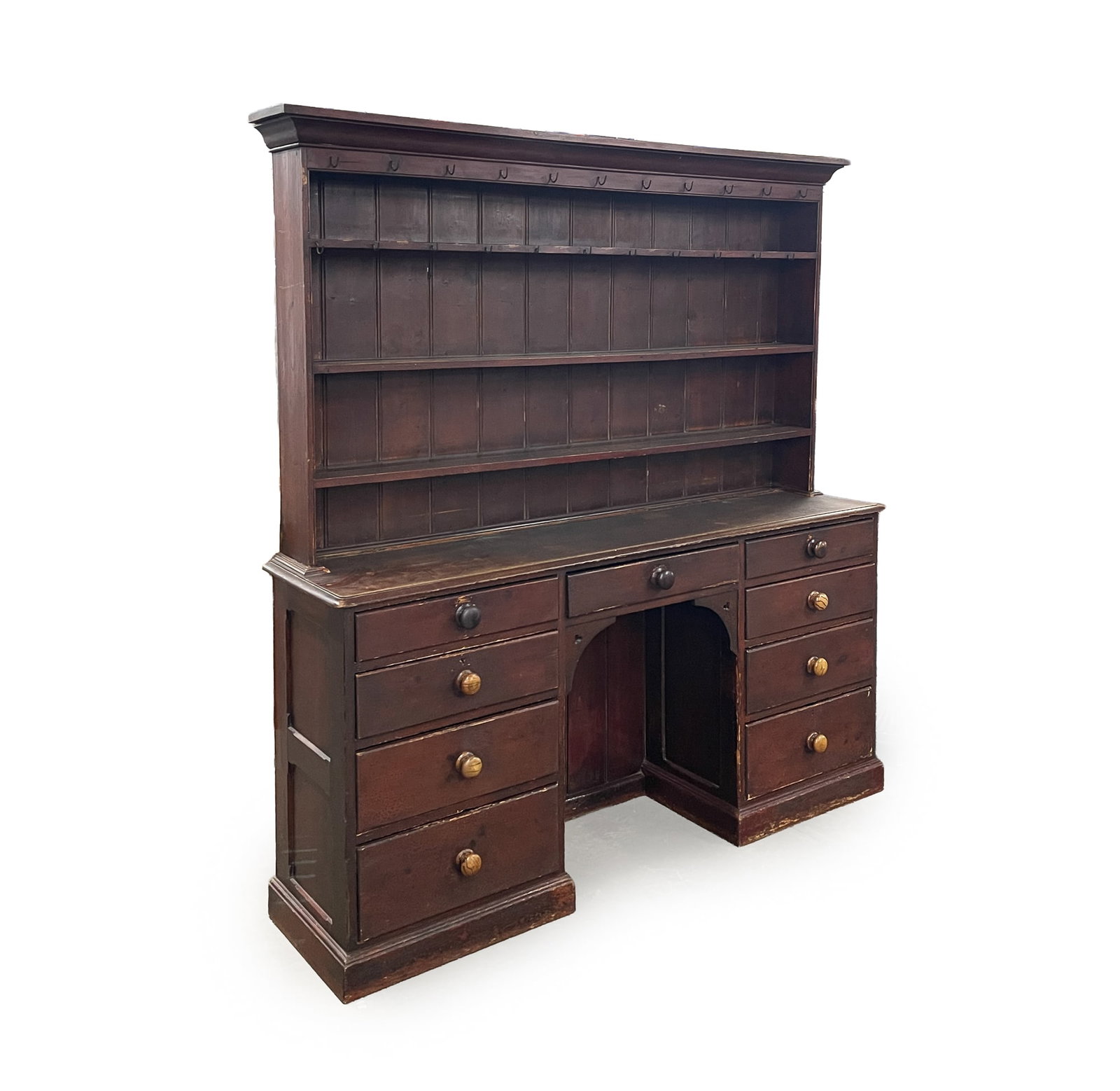 TWO-PIECE AMERICAN COUNTRY KITCHEN DRESSER.: TWO-PIECE AMERICAN COUNTRY KITCHEN DRESSER. Late 19th Century. The upper section having a molded cornice above three shelves and two rows of hooks; the lower section with a projecting, rectangular