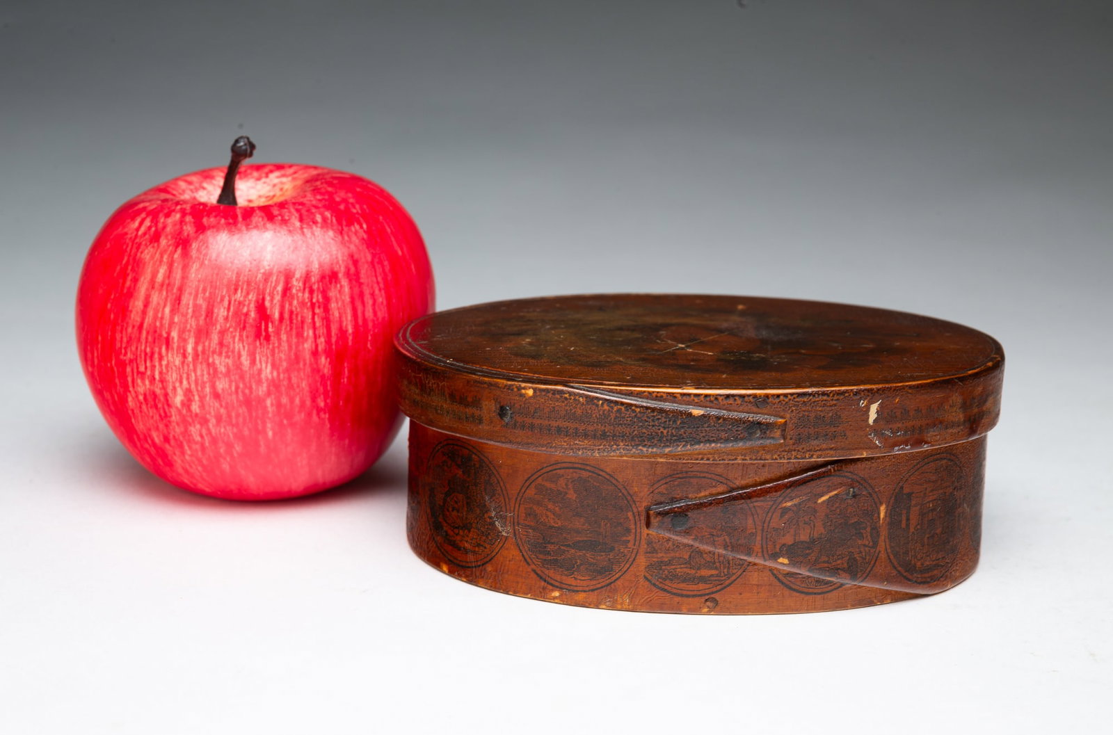 MINIATURE OVAL BENTWOOD PANTRY BOX WITH EXTENSIVE ORIGINAL FOLK ART PAINT DECORATION.: MINIATURE OVAL BENTWOOD PANTRY BOX WITH EXTENSIVE ORIGINAL FOLK ART PAINT DECORATION. American, 19th Century. Single joint on lid and box with copper tacks, the lid printed with an image of a child