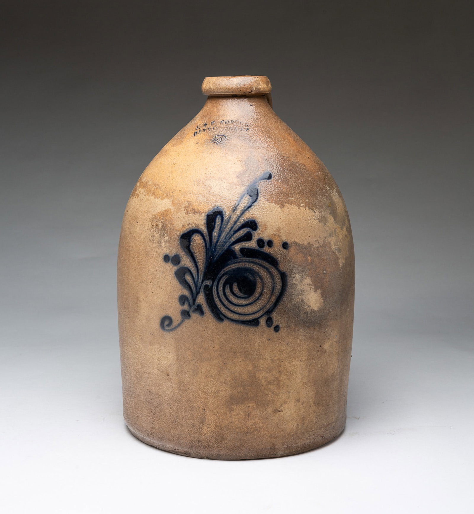 J. & E. NORTON (BENNINGTON, VERMONT) TWO GALLON STONEWARE JAR WITH COBALT SLIP DECORATION.: J. & E. NORTON (BENNINGTON, VERMONT) TWO GALLON STONEWARE JAR WITH COBALT SLIP DECORATION. American, 19th Century. Of cylindrical form with tapered shoulder, applied handle, rolled lip, impressed