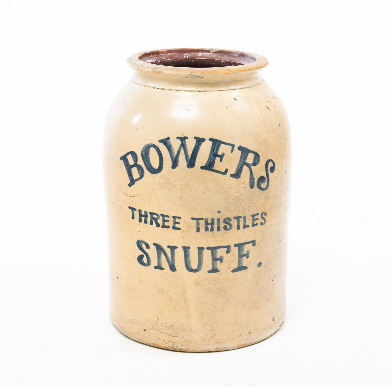 BOWERS THREE THISTLES SNUFF ADVERTISING STONEWARE JAR.: BOWERS THREE THISTLES SNUFF ADVERTISING STONEWARE JAR. American, 19th Century. A tall cylindrical form jar with collared neck and cobalt decoration reading "BOWERS THREE THISTLES SNUFF". 15.5"h. 9"w.