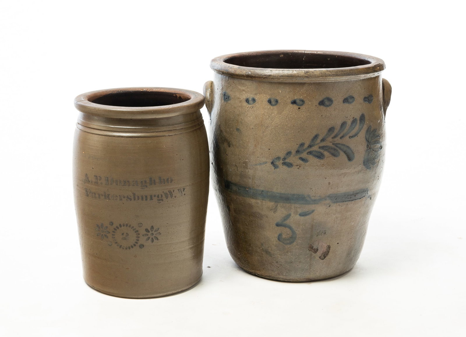 TWO STONEWARE JARS WITH COBALT DECORATION. (1 of 5)