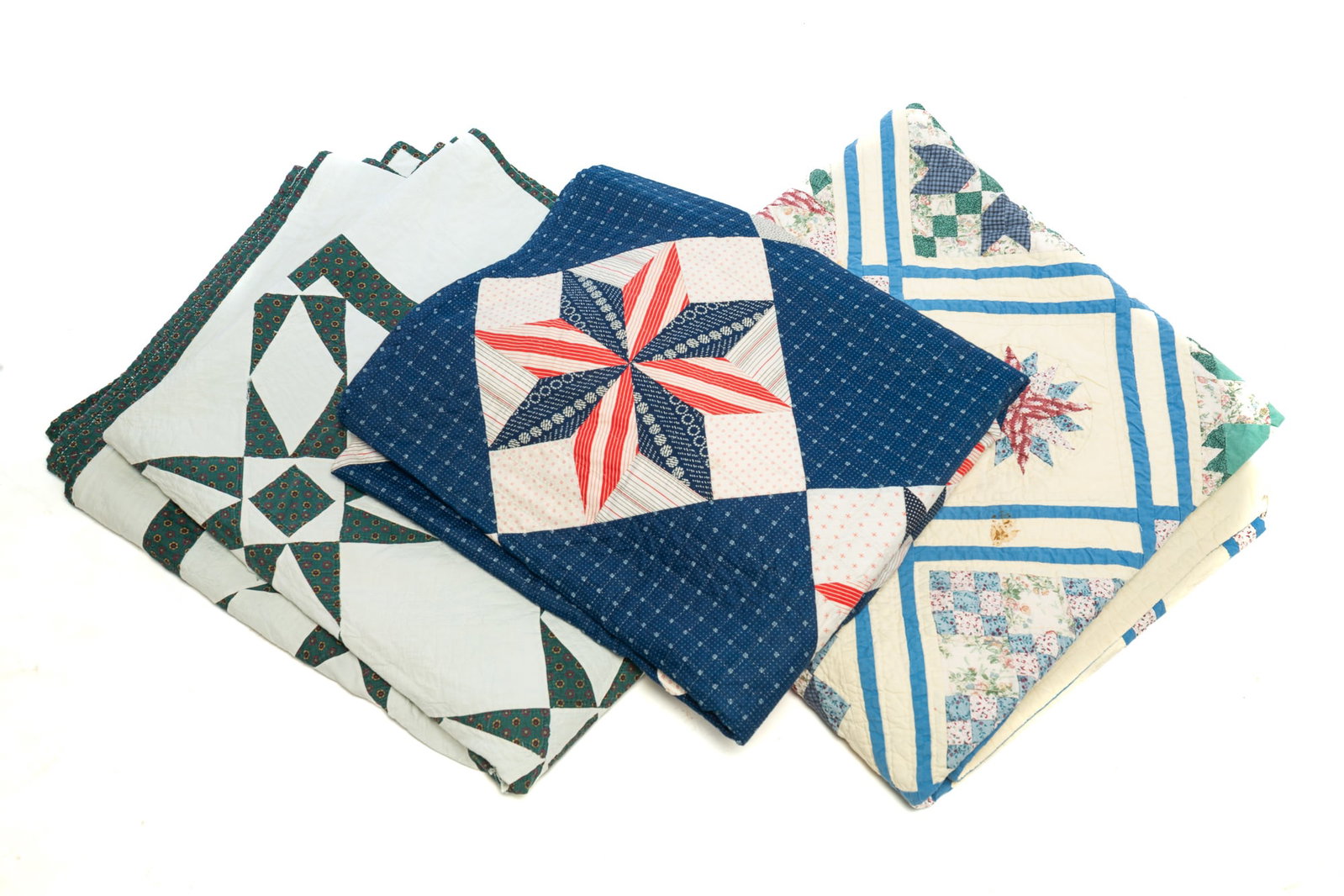 THREE HAND-STITCHED COTTON QUILTS.: THREE HAND-STITCHED COTTON QUILTS. American, 19th Century. Red, white, and blue stars. 65"w. 84"l. Green and white. 84"w. 96"l. Multi-patterned. 86"w. 86"l. Provenance: The Lifetime Collection of
