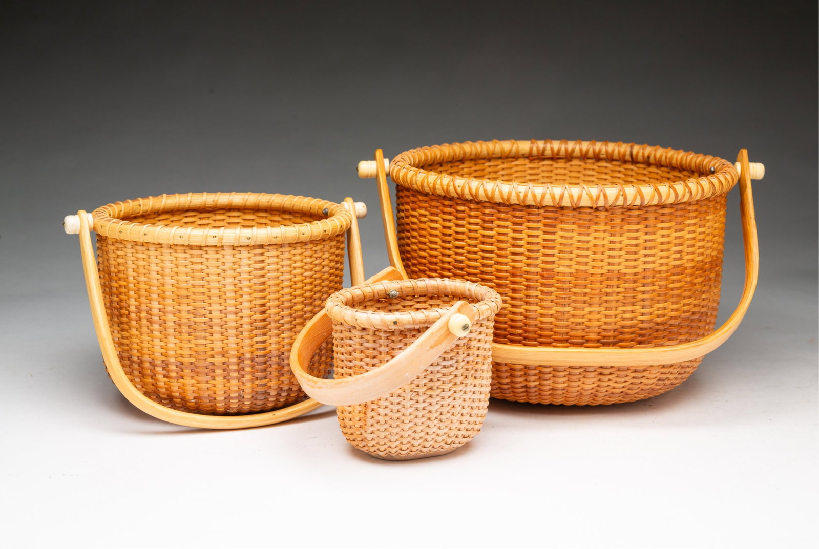 THREE NANTUCKET SWING HANDLE LIGHTSHIP BASKETS. (1 of 5)