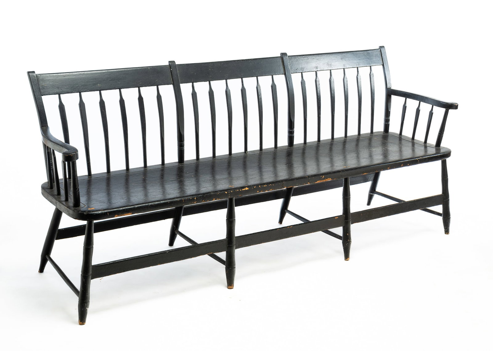 EBONIZED ARROW-BACK WINDSOR SETTEE.: EBONIZED ARROW-BACK WINDSOR SETTEE. American, Early 19th Century. Mixed woods. Three-section back with curved stiles, arms with scrolled ends, one board seat. Base with bamboo turned legs and slat