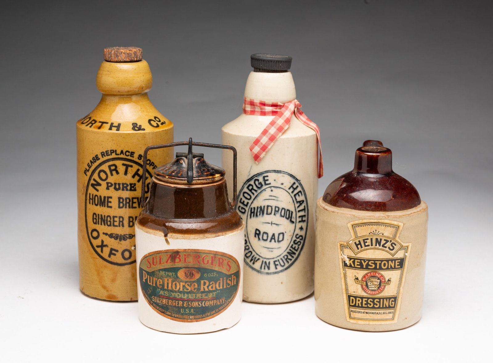 FOUR SMALL STONEWARE BOTTLES AND CONTAINERS, INCL. HEINZ. (1 of 9)