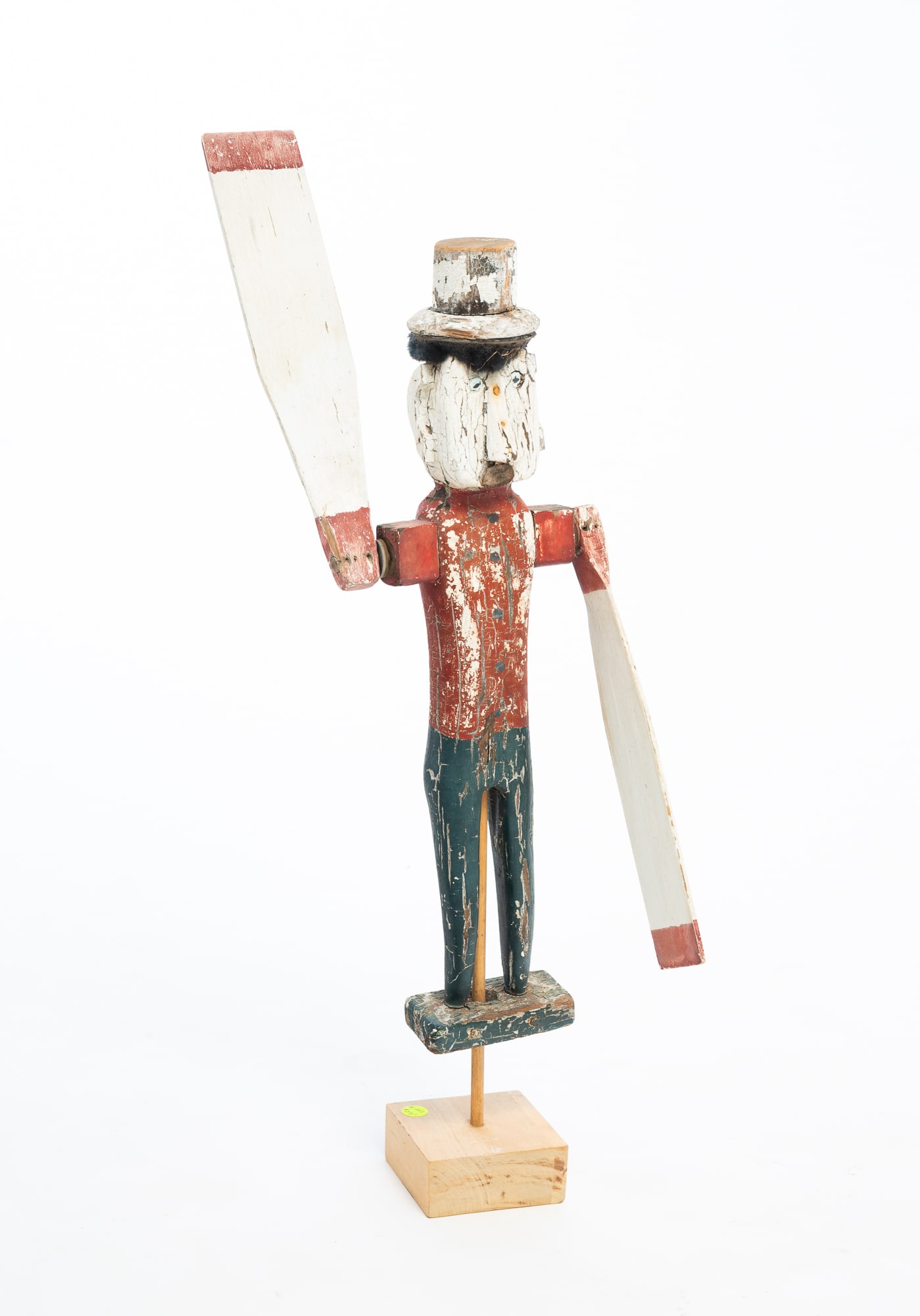 FOLK ART CARVED WHIRLIGIG FIGURE WITH ORIGINAL PAINT.: FOLK ART CARVED WHIRLIGIG FIGURE WITH ORIGINAL PAINT. American, Late 19th or Early 20th Century. Man wearing a white top hat atop black hair, blue eyes, triangle nose, crescent-shaped ears, and leathe