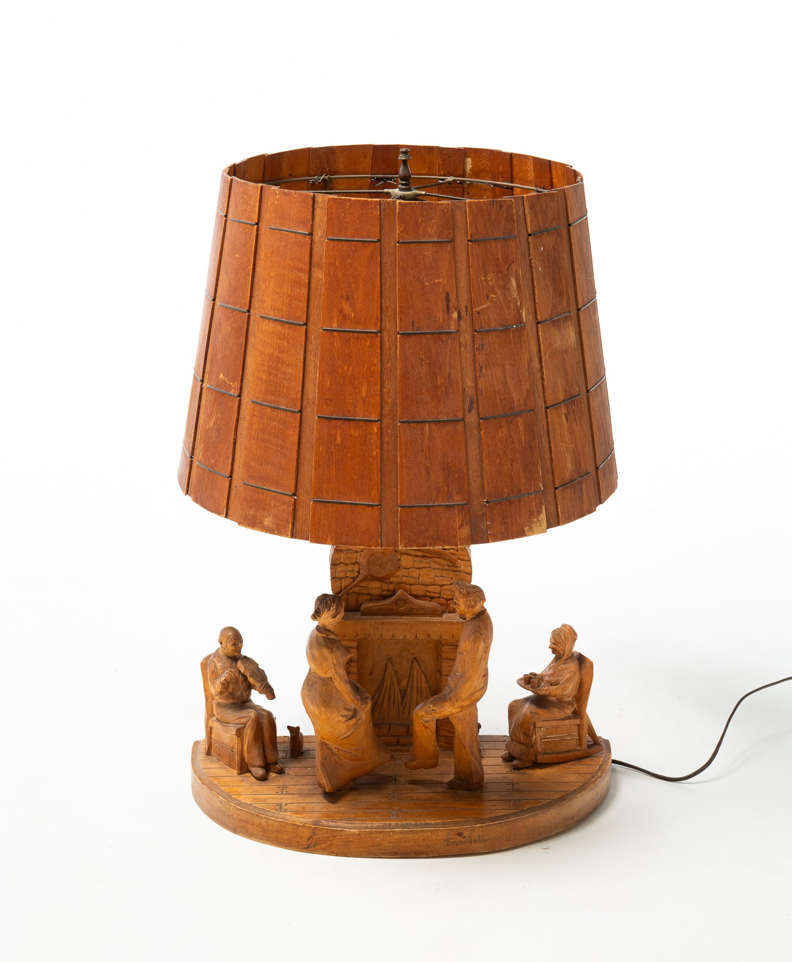FOLKSY CARVED TABLE LAMP DEPICTING A FAMILY NEAR THE HEARTH. (1 of 3)